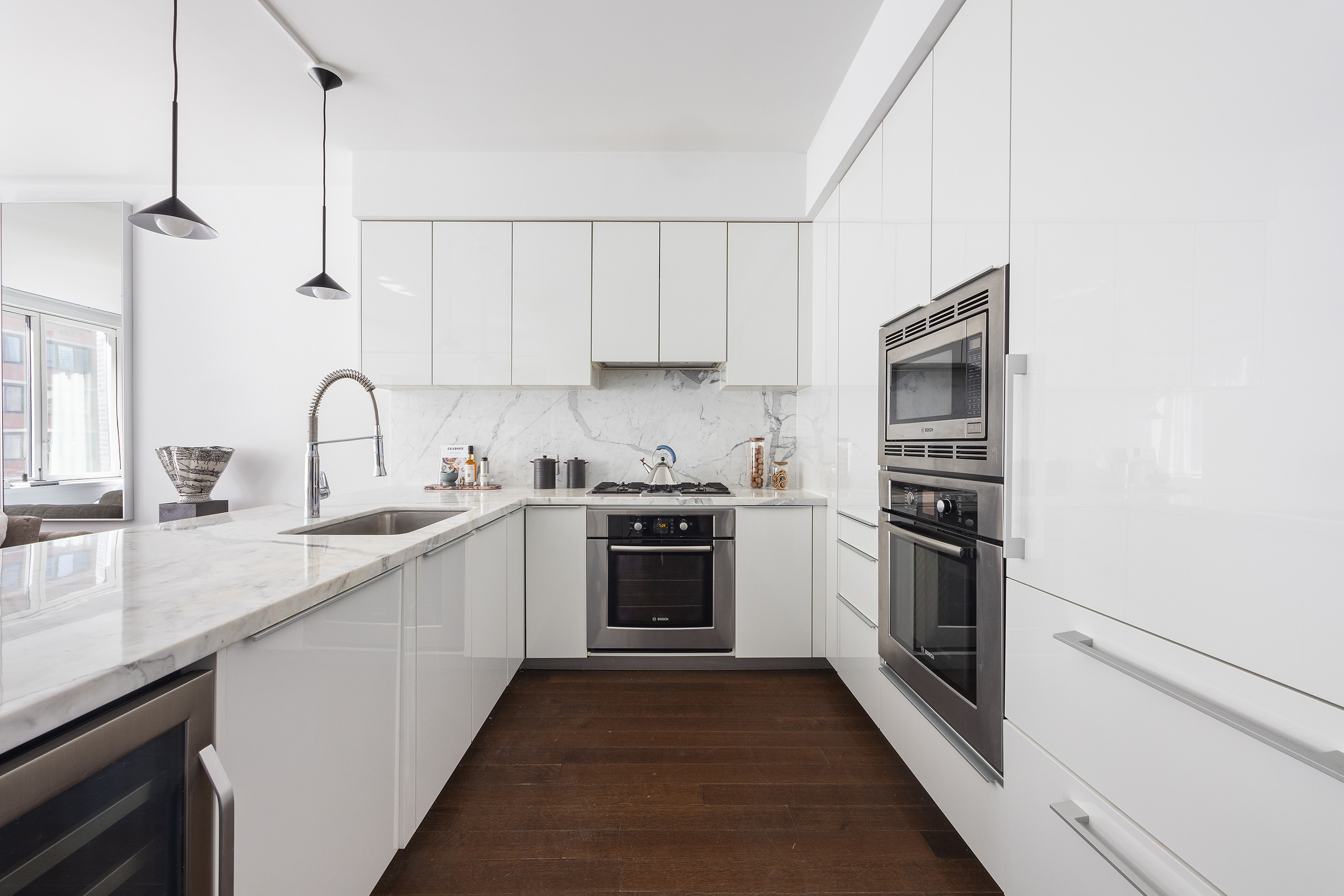 5 Franklin Place, Unit 9D Manhattan, NY 10013 - Photo 6 of 20 a kitchen with granite countertop a sink stainless steel appliances and cabinets