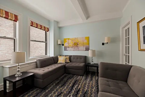 a living room with furniture and a window