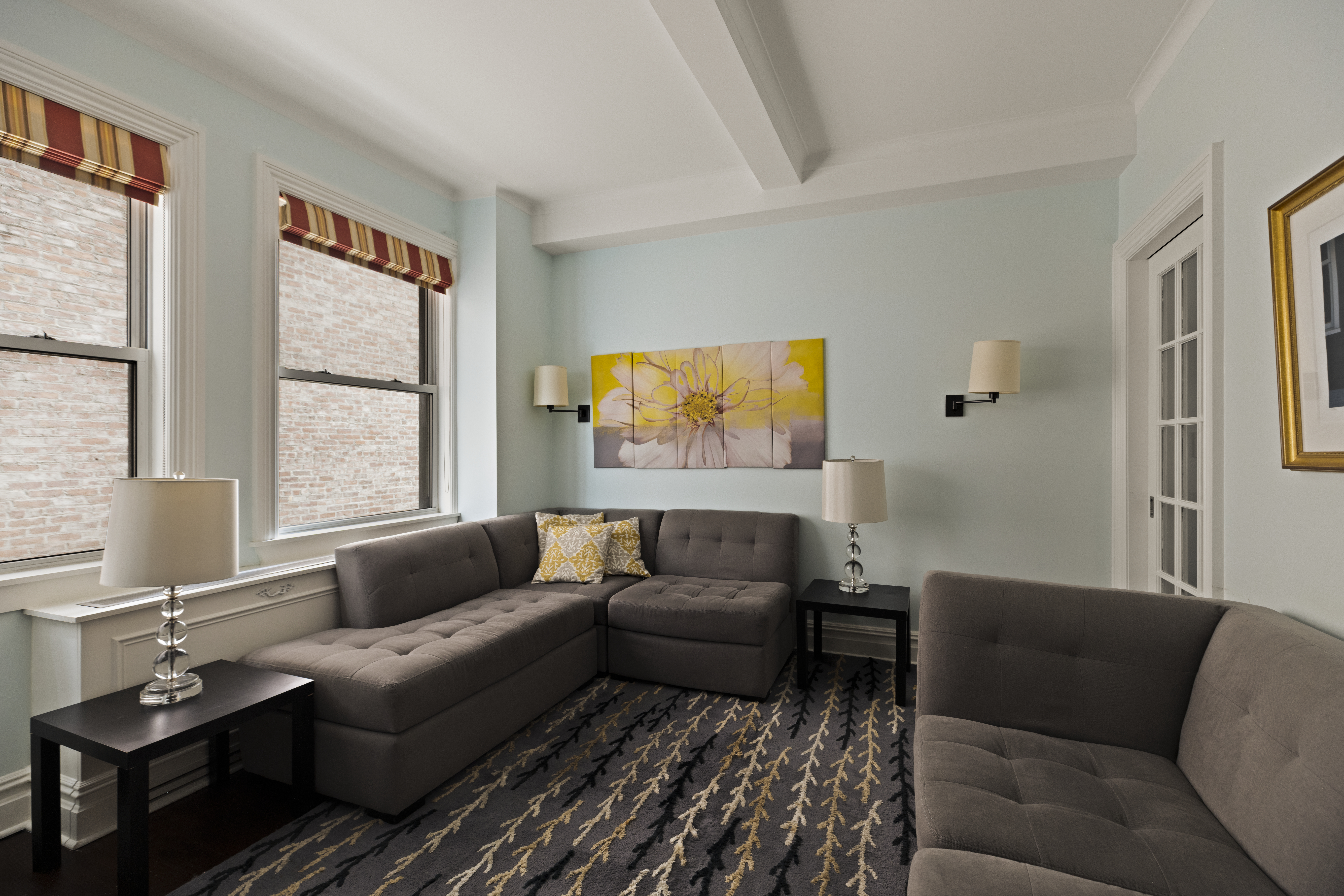 1158 5th Avenue, Unit 4A Manhattan, NY 10128 - Photo 14 of 23 a living room with furniture and a window