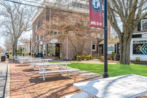 a view of a building with a yard