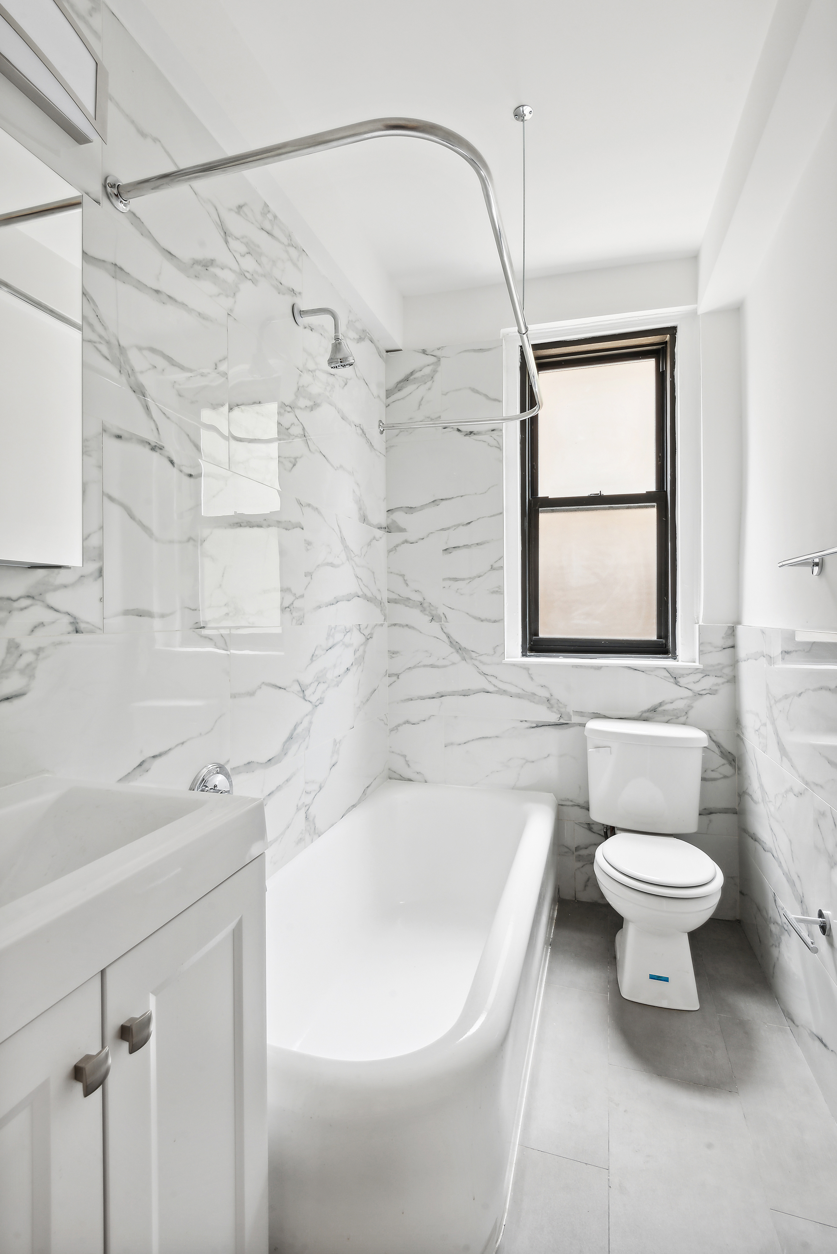 110 West 86th Street, Unit 2D Manhattan, NY 10024 - Photo 4 of 5 a bathroom with a sink toilet and shower