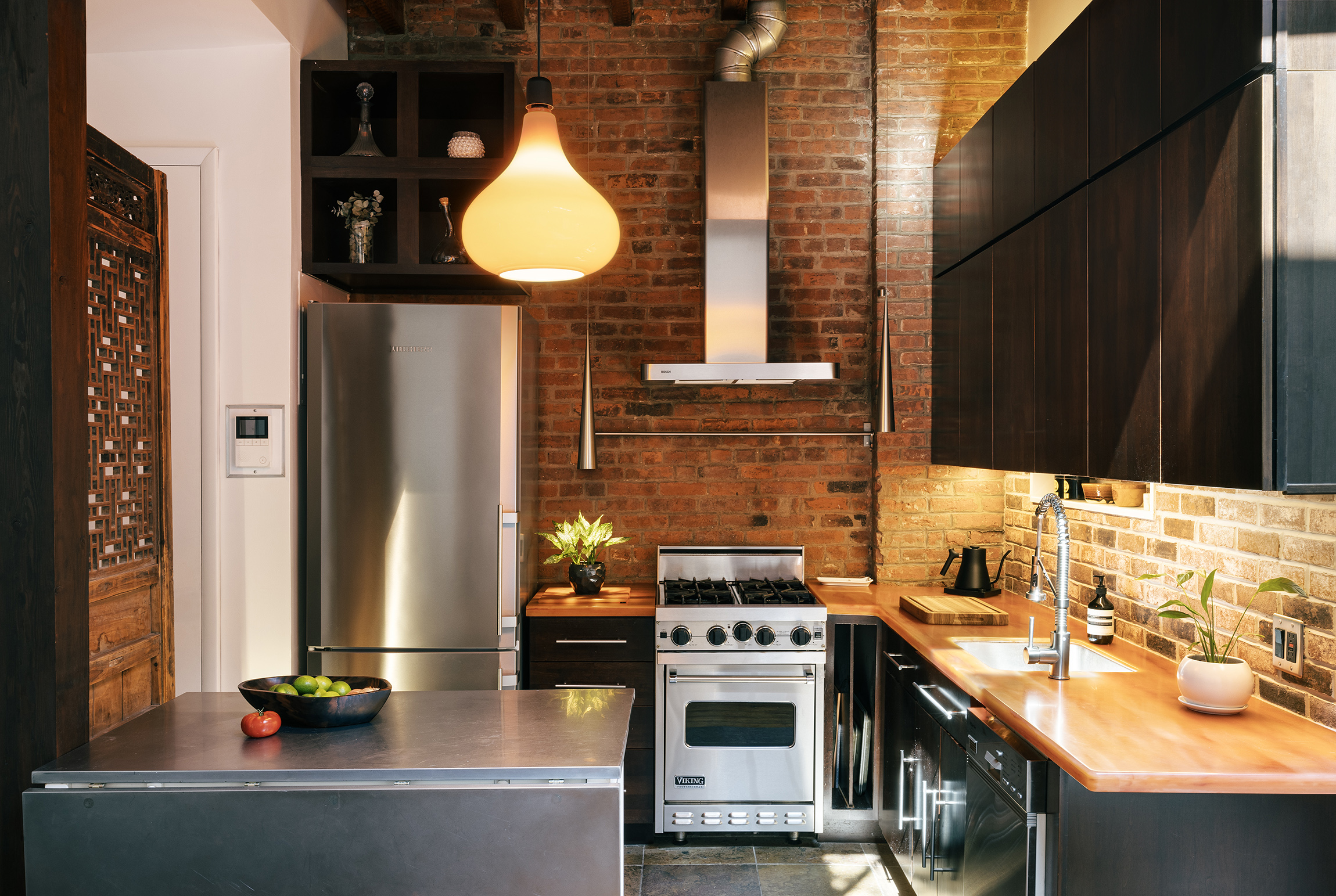 184 Franklin Street, Unit 10 Manhattan, NY 10013 - Photo 3 of 8 a kitchen with a sink cabinets and a stove