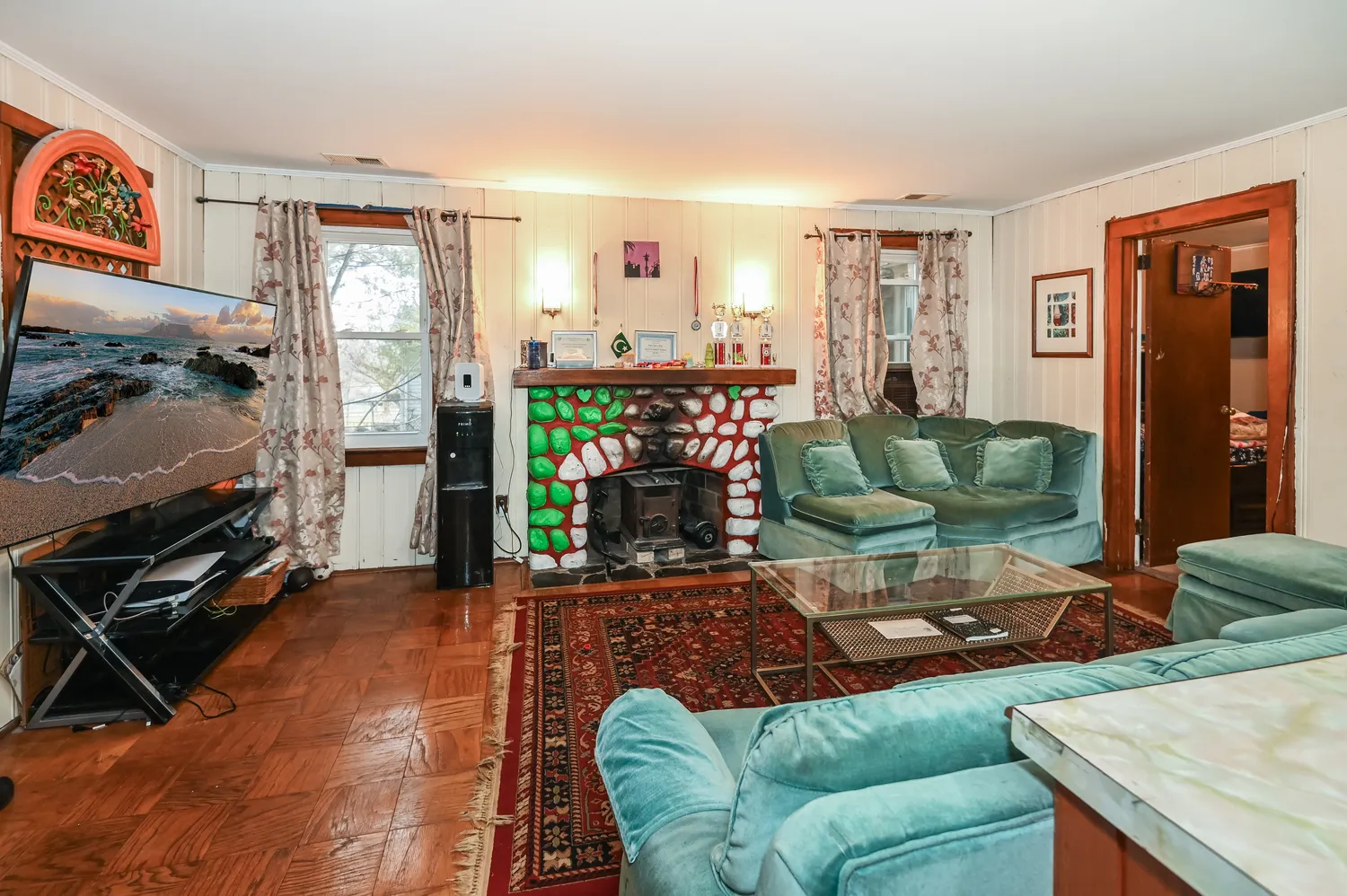 a living room with furniture and a flat screen tv