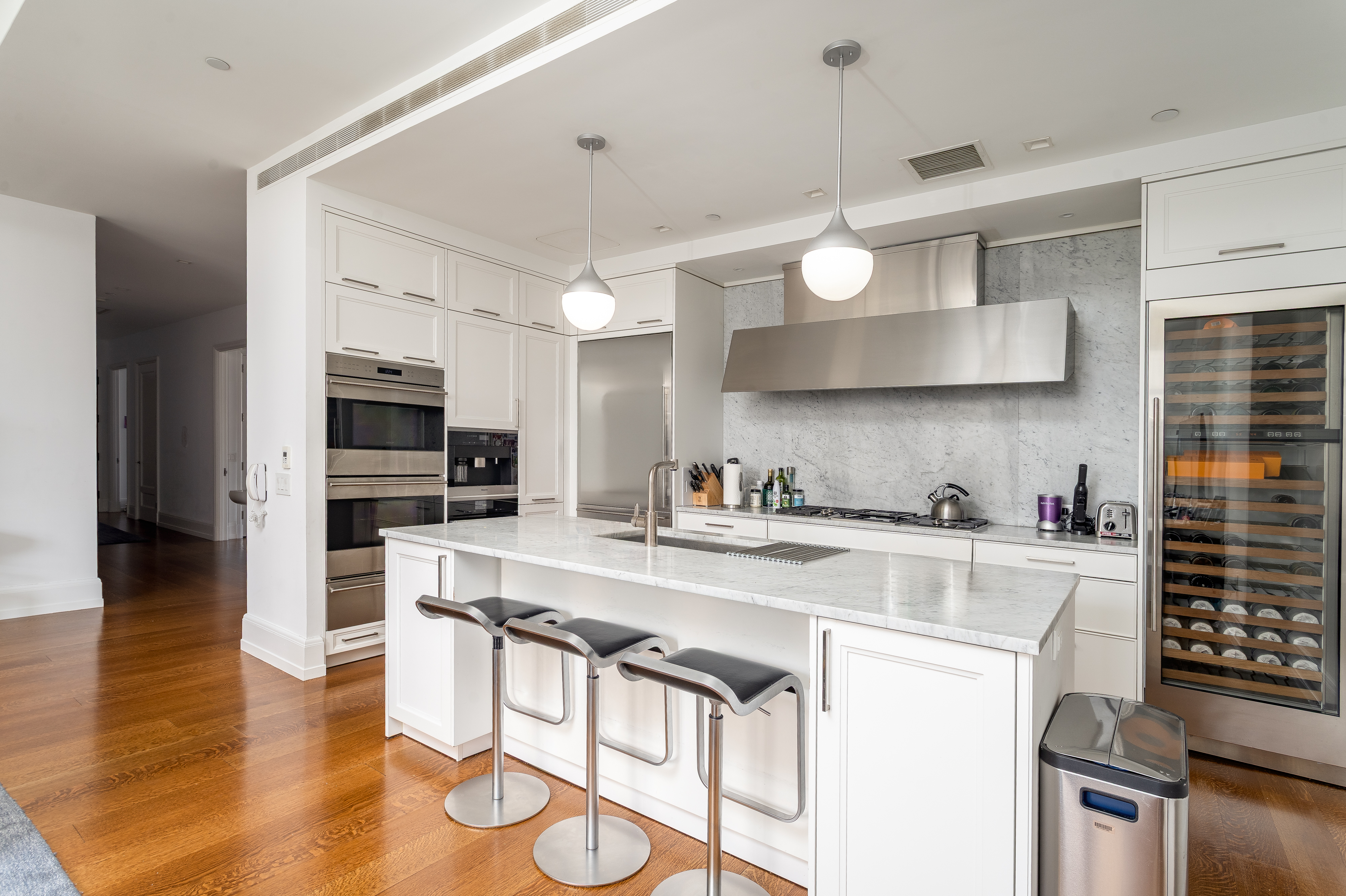 10 Madison Square West, Unit 16F Manhattan, NY 10010 - Photo 8 of 15 a kitchen with a stove a sink and a refrigerator