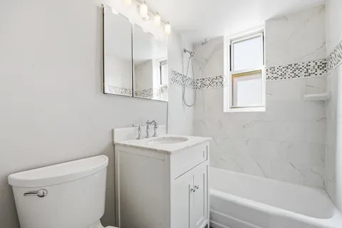 a bathroom with a sink a toilet and a bathtub