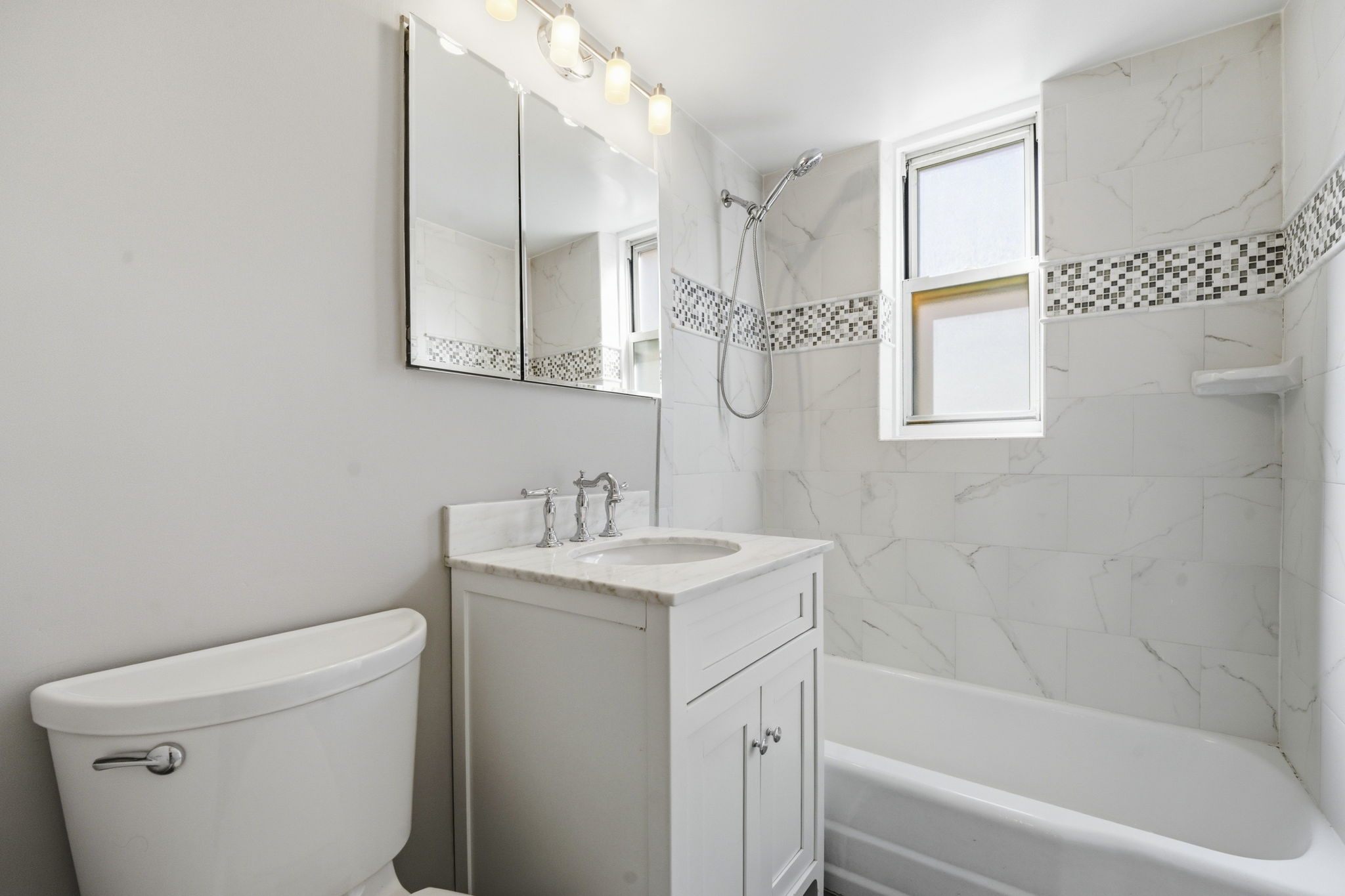 139 East 33rd Street, Unit 12DE Manhattan, NY 10016 - Photo 21 of 27 a bathroom with a sink a toilet and a bathtub