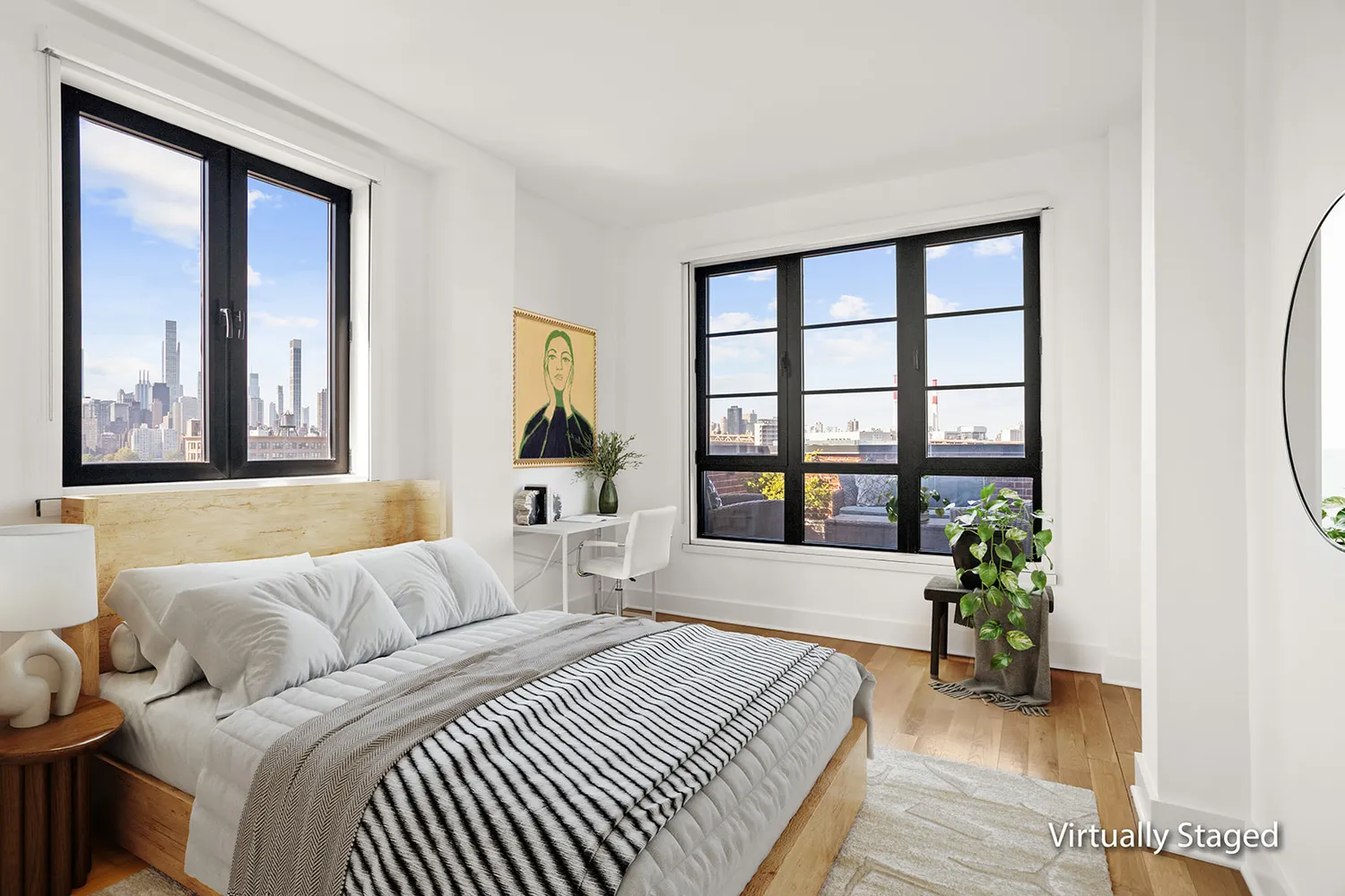 a bedroom with a bed and a large window