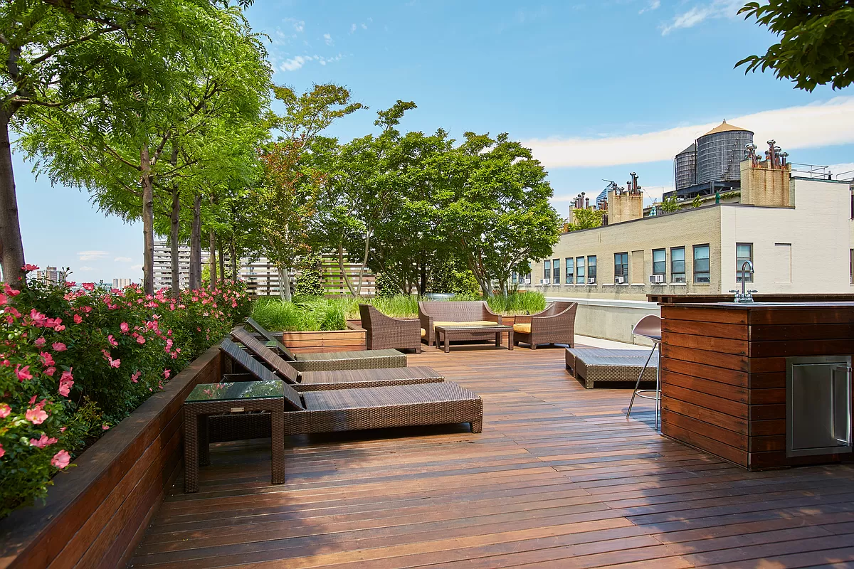 133 West 22nd Street, Unit 12B Manhattan, NY 10011 - Photo 11 of 12 a outdoor space with patio couch and a garden