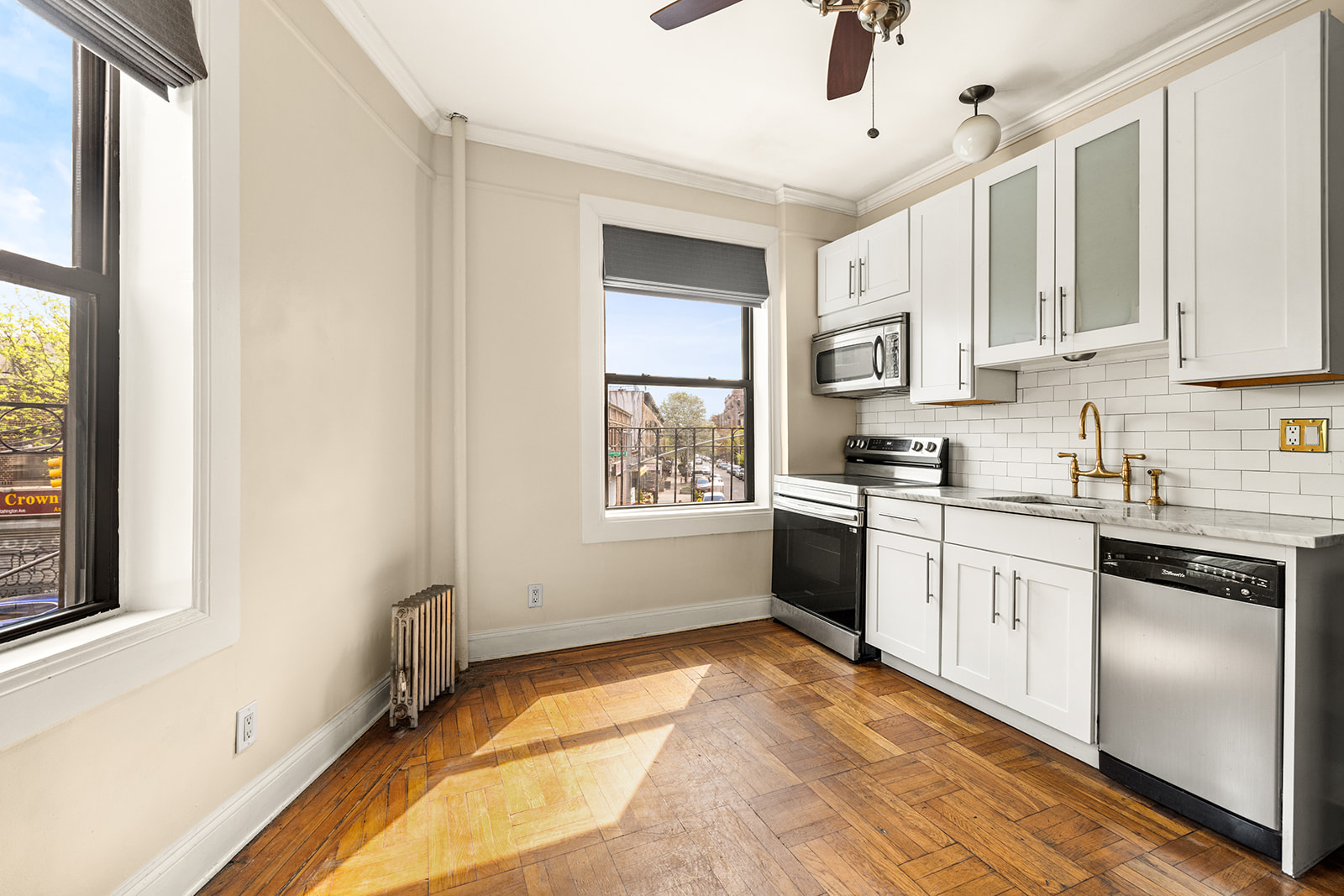 400 Lincoln Place, Unit 2B Brooklyn, NY 11238 - Photo 7 of 10 a kitchen with stainless steel appliances granite countertop a stove a sink and a refrigerator
