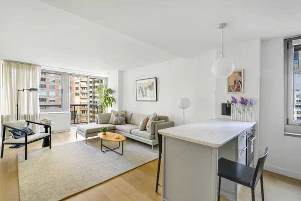 a living room with furniture and a table