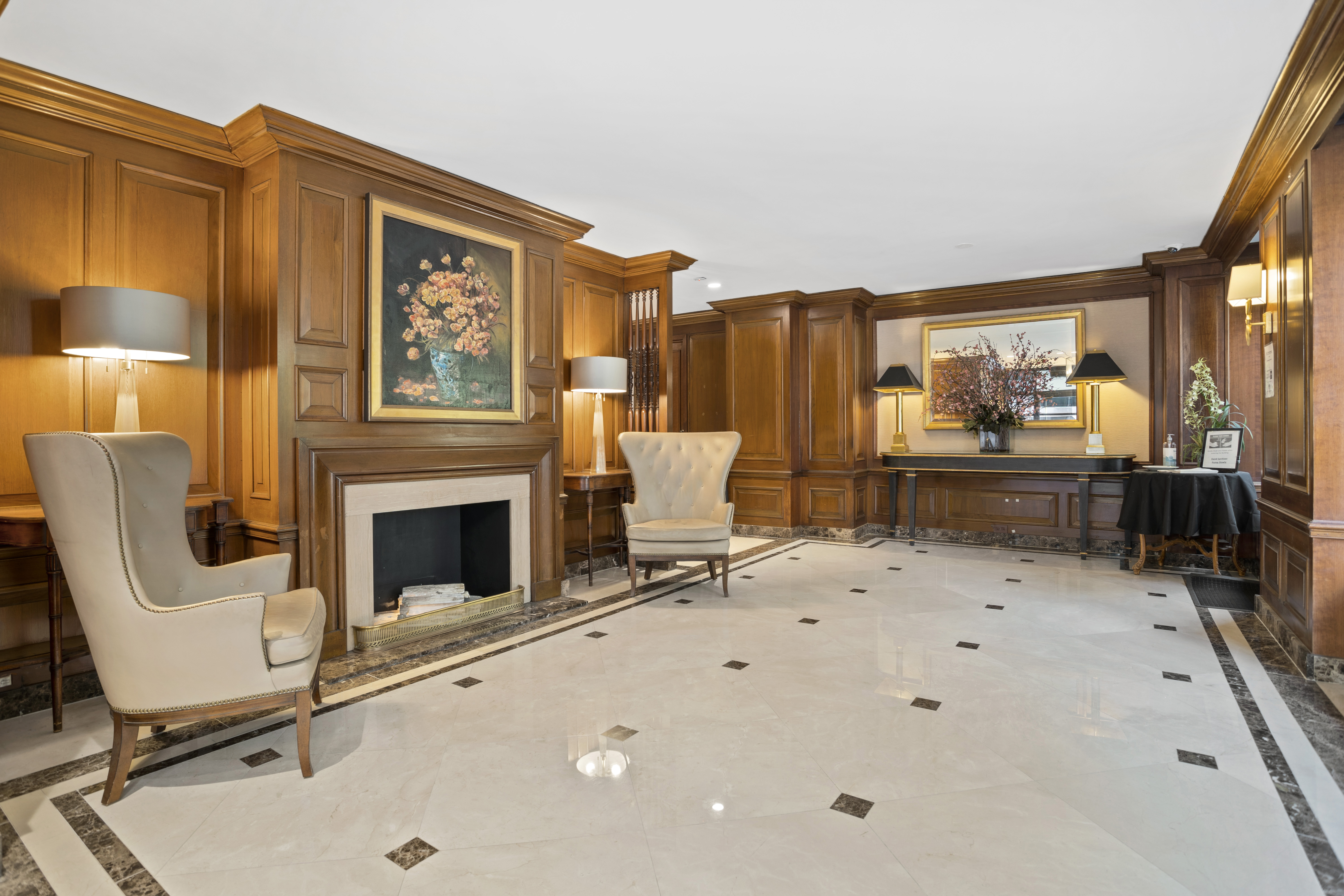 137 East 36th Street, Unit 21F Manhattan, NY 10016 - Photo 13 of 18 a living room with furniture a fireplace and a large window