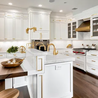 a kitchen with stainless steel appliances a stove a sink and a refrigerator