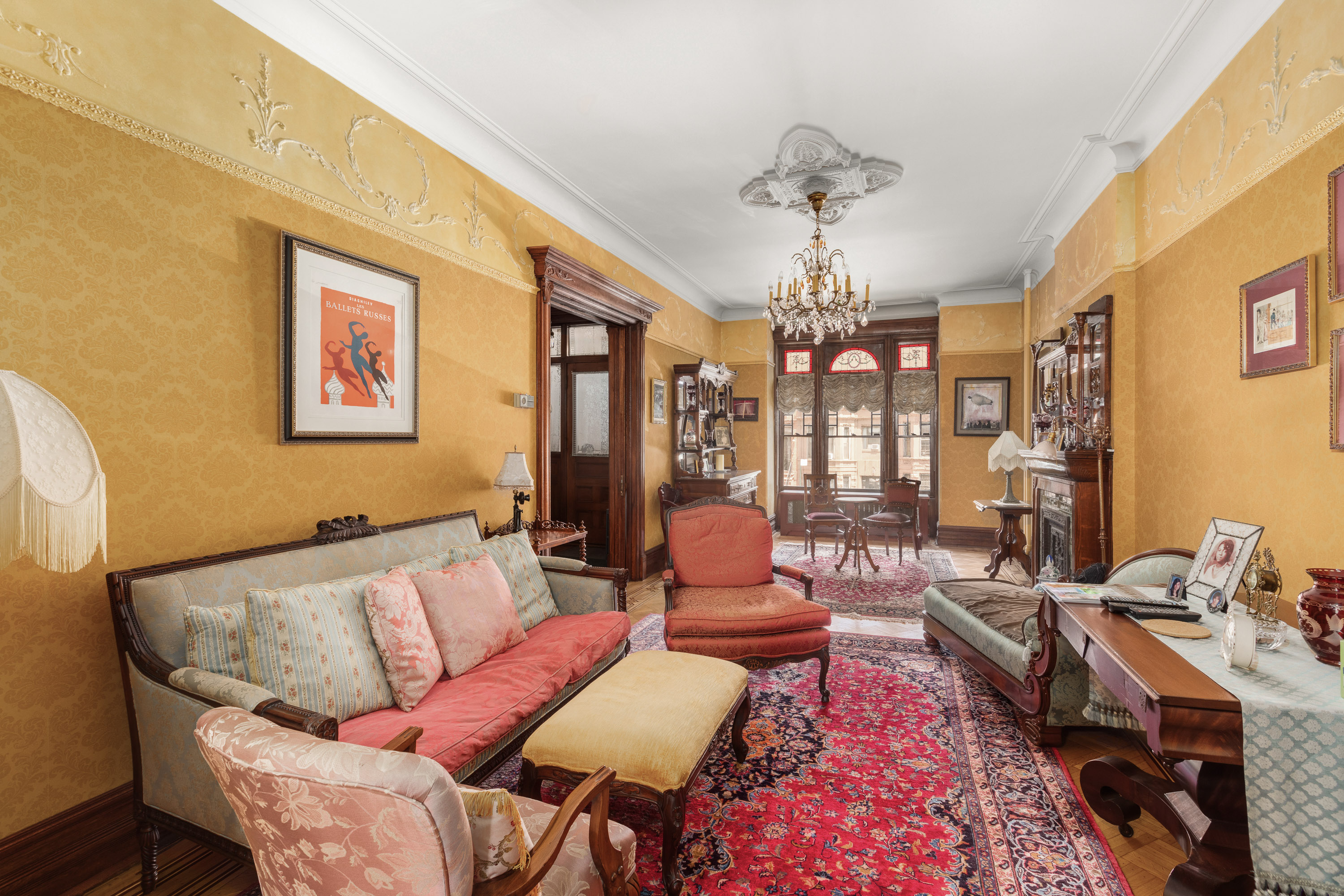 470 9th Street Brooklyn, NY 11215 - Photo 6 of 25 a living room with furniture and a chandelier