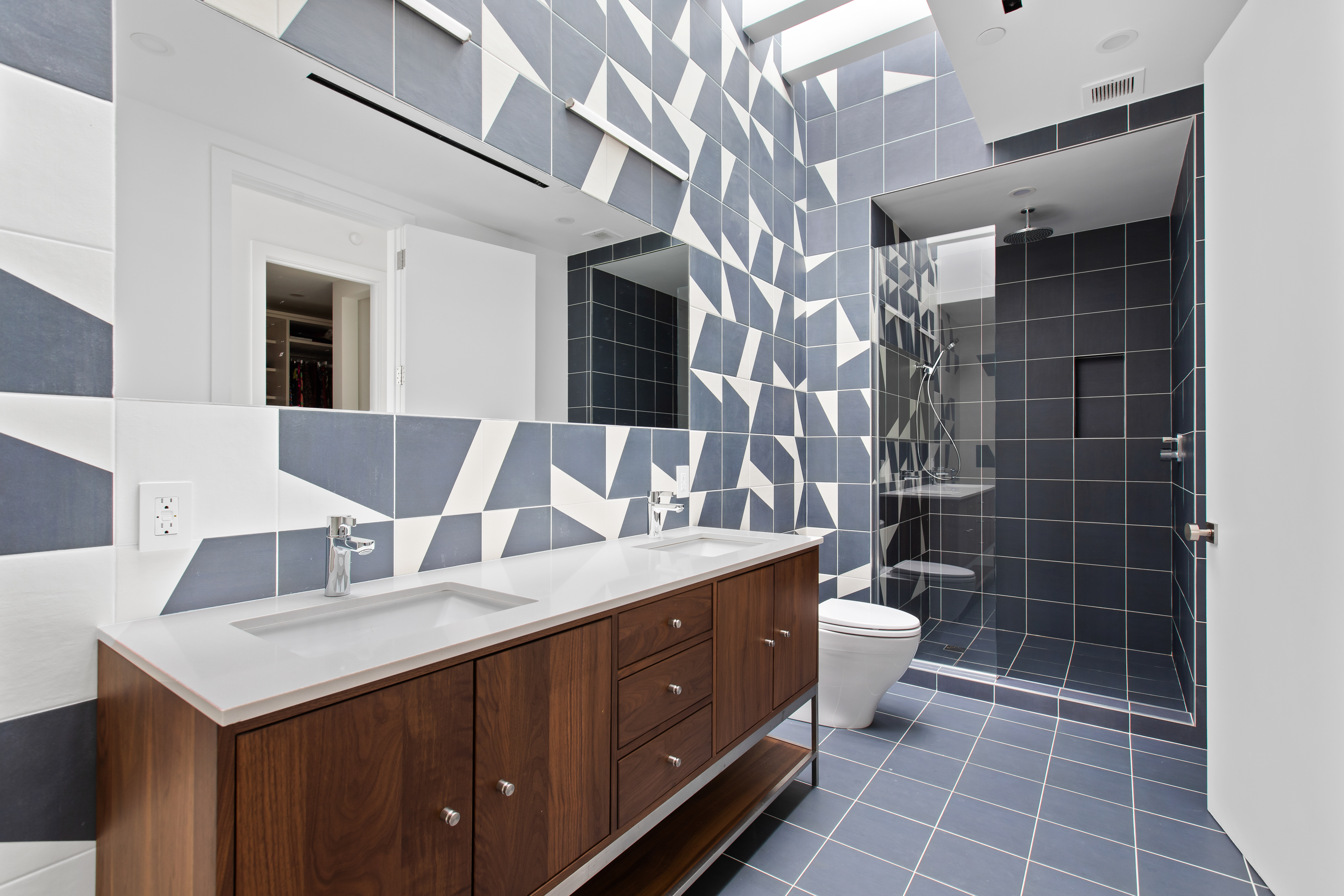 42 Sharon Street Brooklyn, NY 11211 - Photo 20 of 28 a bathroom with a double vanity sink a toilet and a mirror