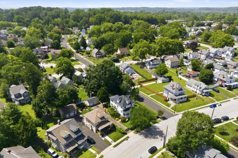 an aerial view of residential house with outdoor space and mountain view