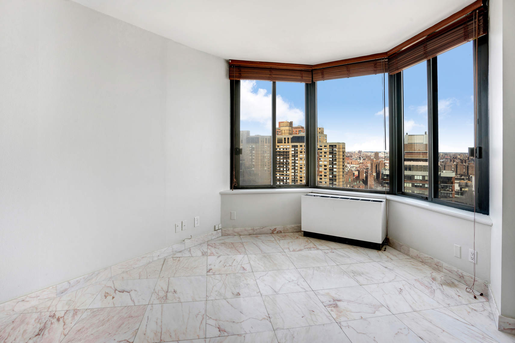 300 East 93rd Street, Unit 35D Manhattan, NY 10128 - Photo 11 of 13 a view of an empty room with a window