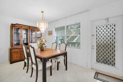 a view of a dining room with furniture and window
