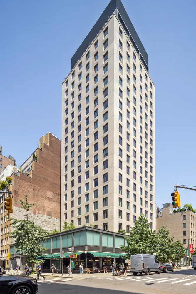 a view of a tall building and a street view