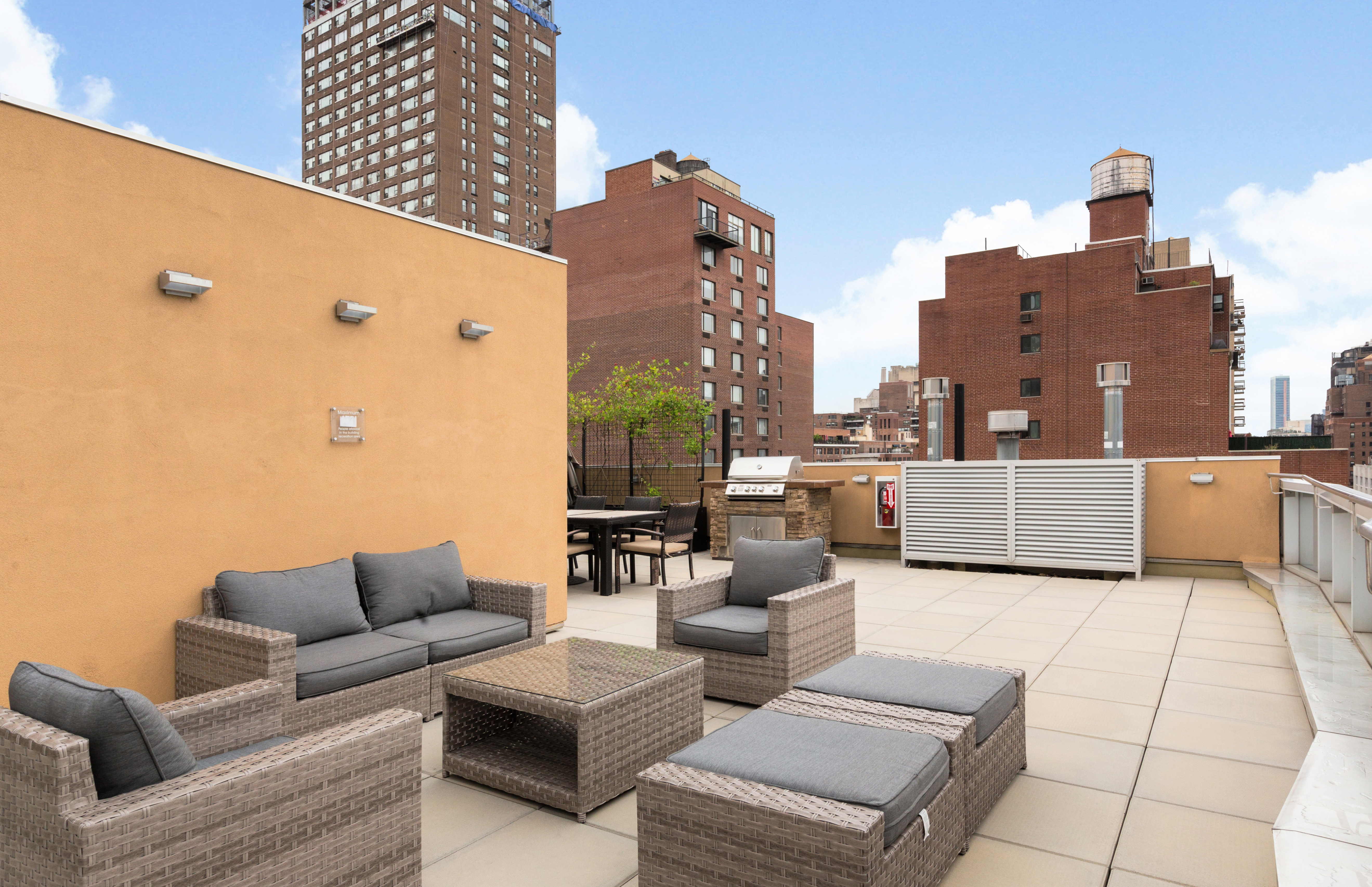 337 East 62nd Street, Unit 3C Manhattan, NY 10065 - Photo 12 of 14 a view of city from balcony with seating space