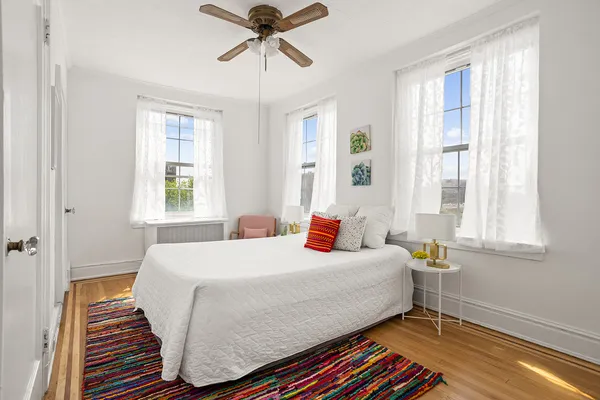 a bedroom with a bed and window