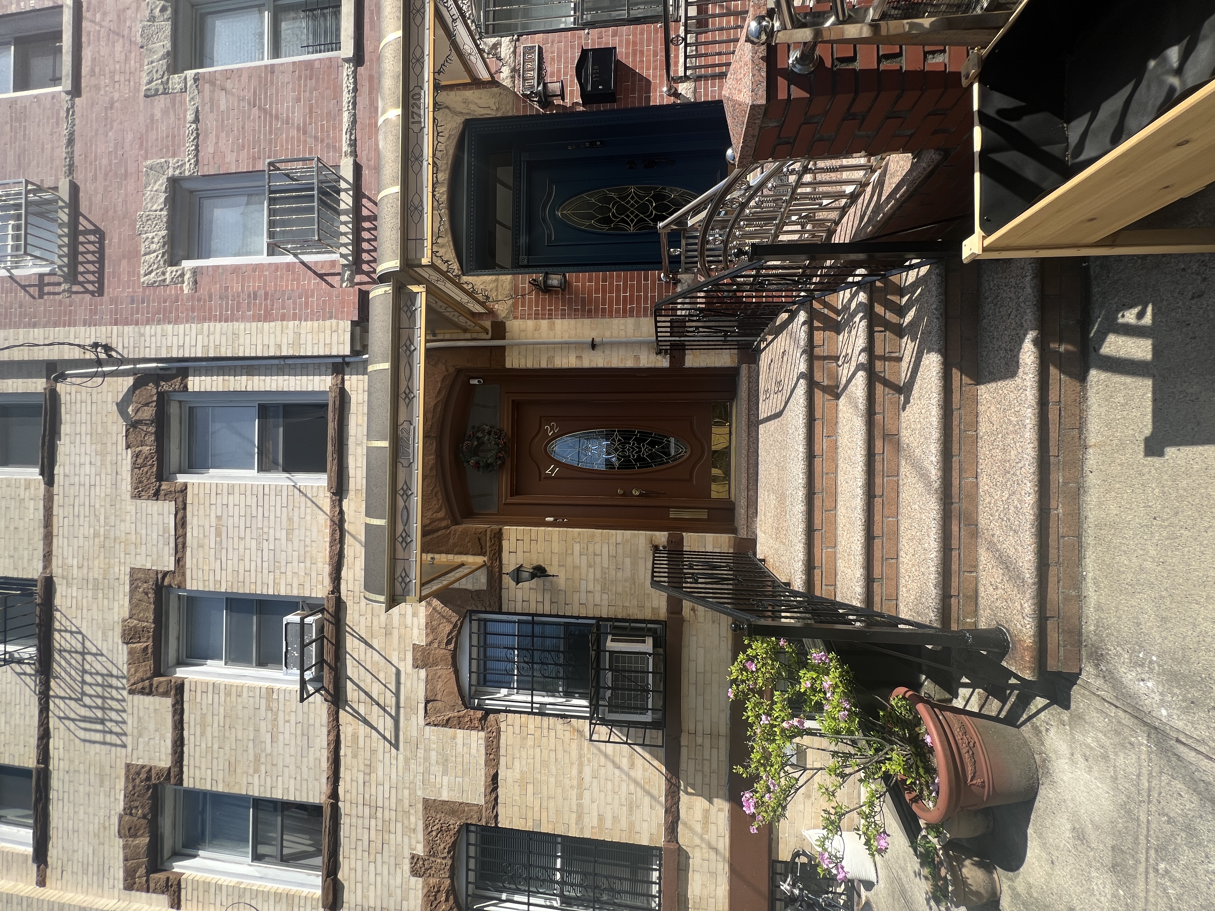 17-22 Menahan Street, Unit 1 Queens, NY 11385 - Photo 9 of 9 a front view of a house with entryway