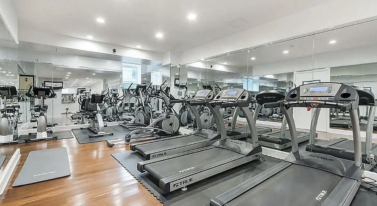150 West 51st Street, Unit 1528 Manhattan, NY 10019 - Photo 9 of 21 a view of a room with gym equipment