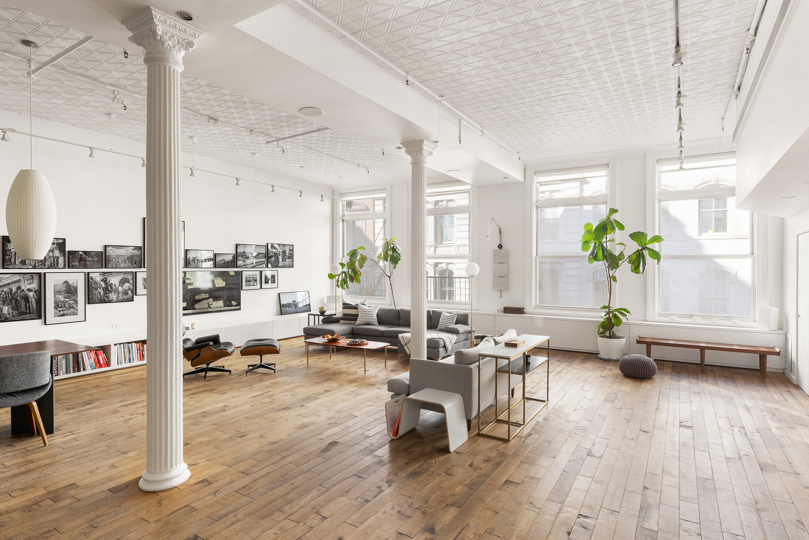 22 East 18th Street, Unit 4E Manhattan, NY 10003 - Photo 3 of 13 a living room with furniture and wooden floor