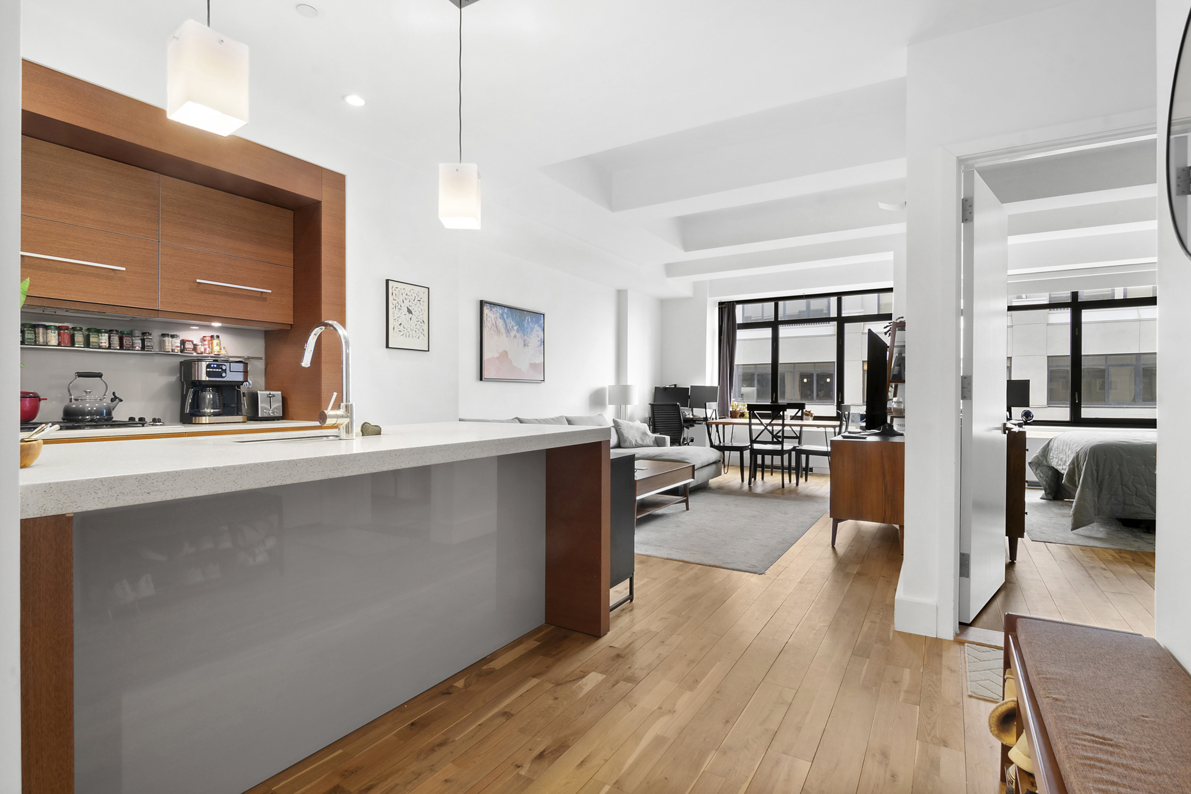 360 Furman Street, Unit 1138 Brooklyn, NY 11201 - Photo 2 of 34 a kitchen with counter top space and wooden floor