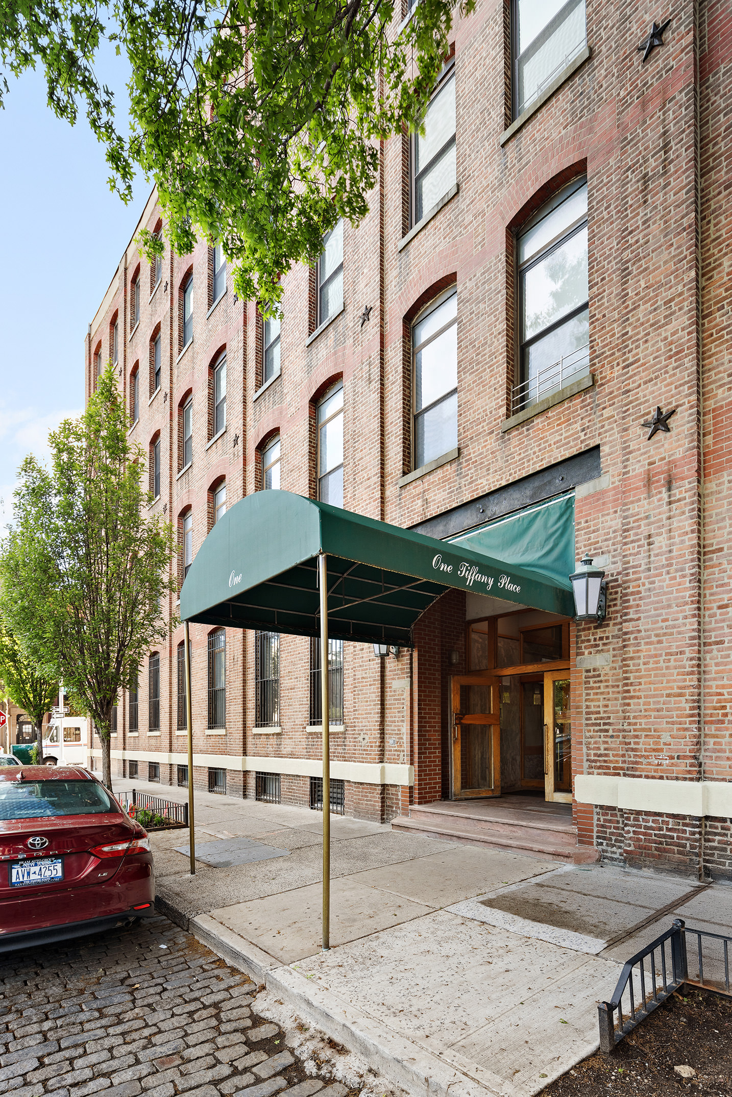 1 Tiffany Place, Unit 2F Brooklyn, NY 11231 - Photo 11 of 12 a couple of table and chairs in front of building