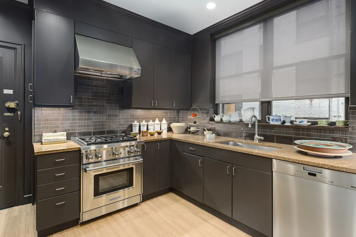 a kitchen with stainless steel appliances granite countertop a stove and a sink