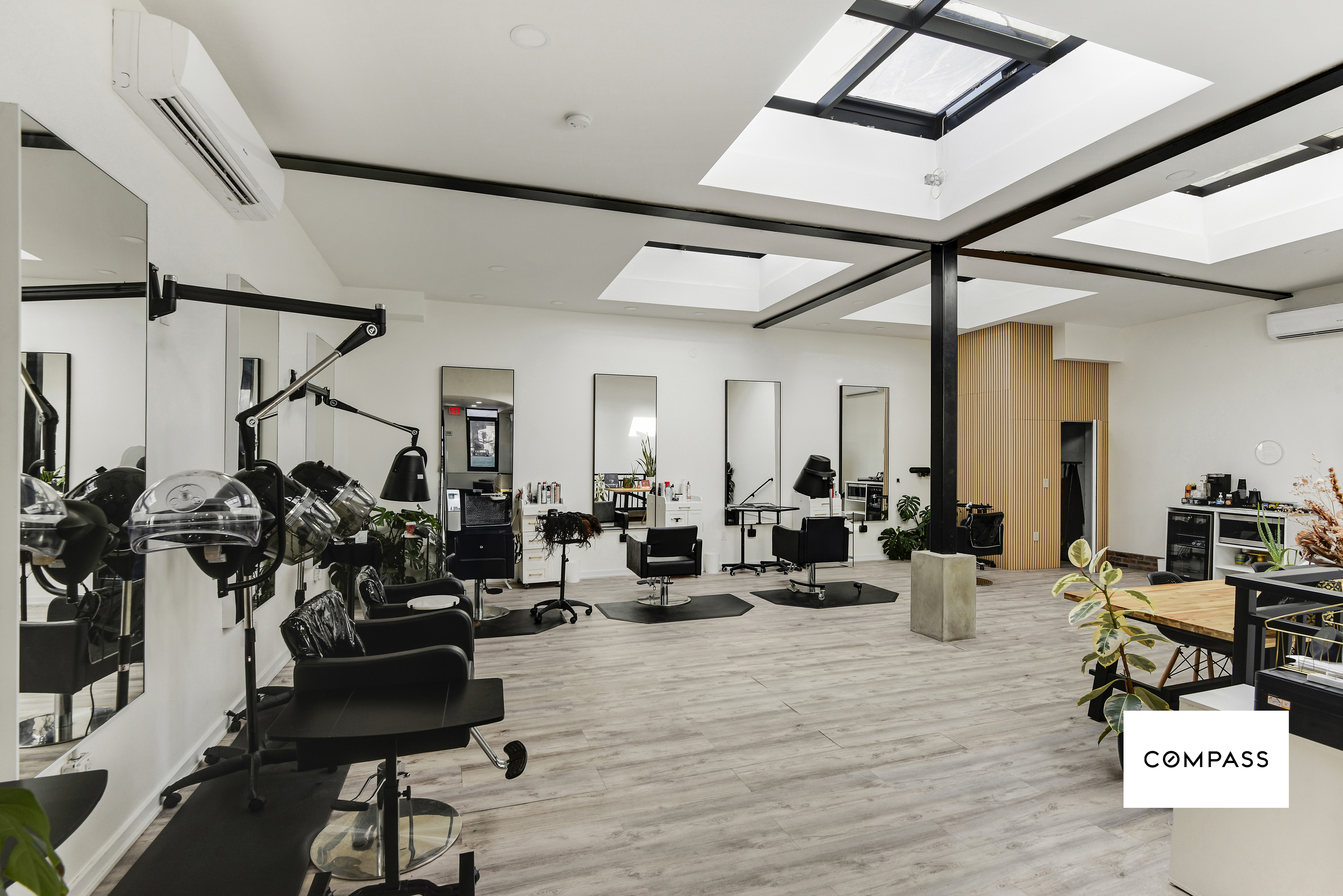 42 Jackson Street Brooklyn, NY 11211 - Photo 6 of 12 a living room with lots of furniture and gym equipment