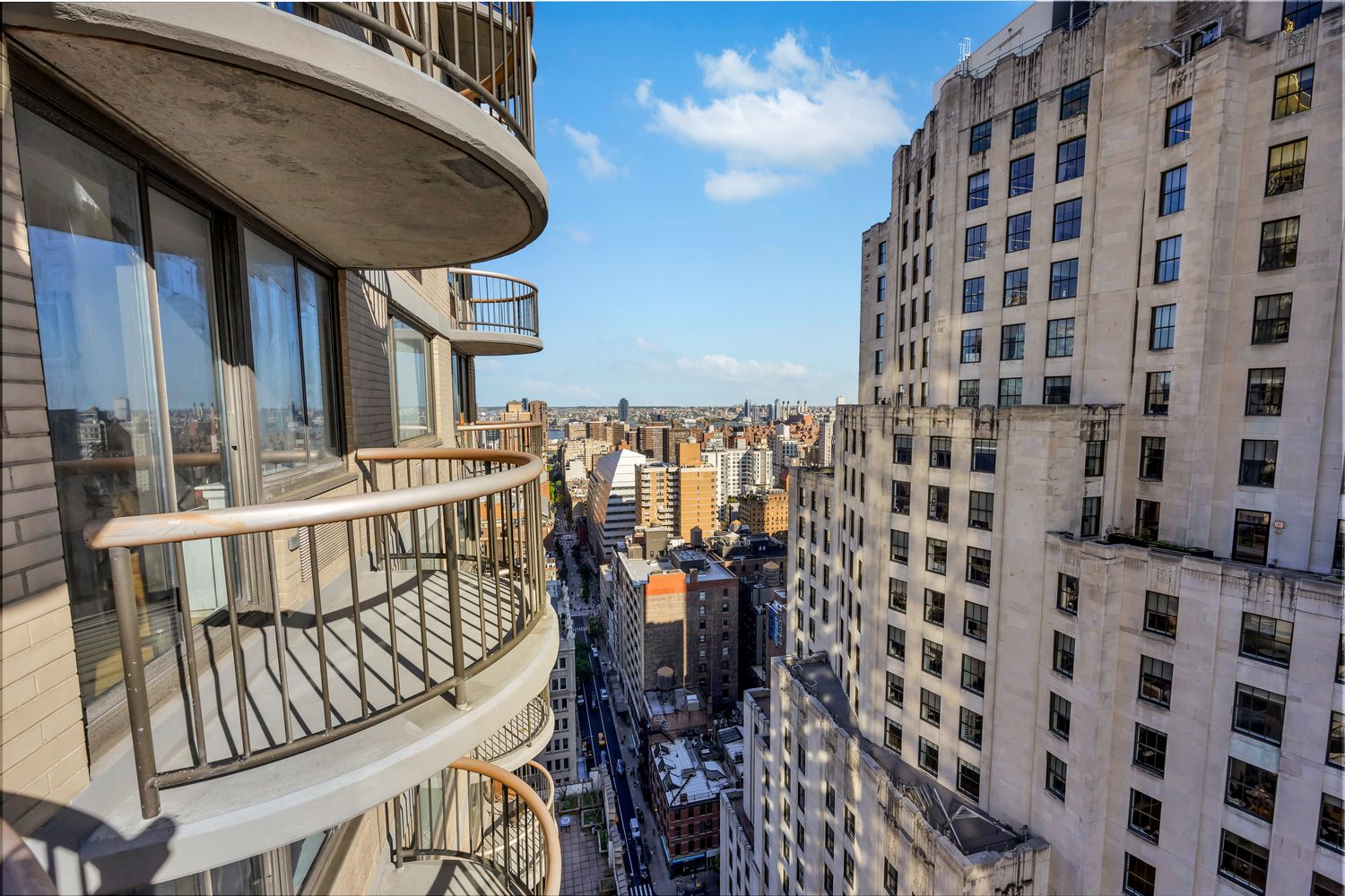 a view of balcony with wooden floor