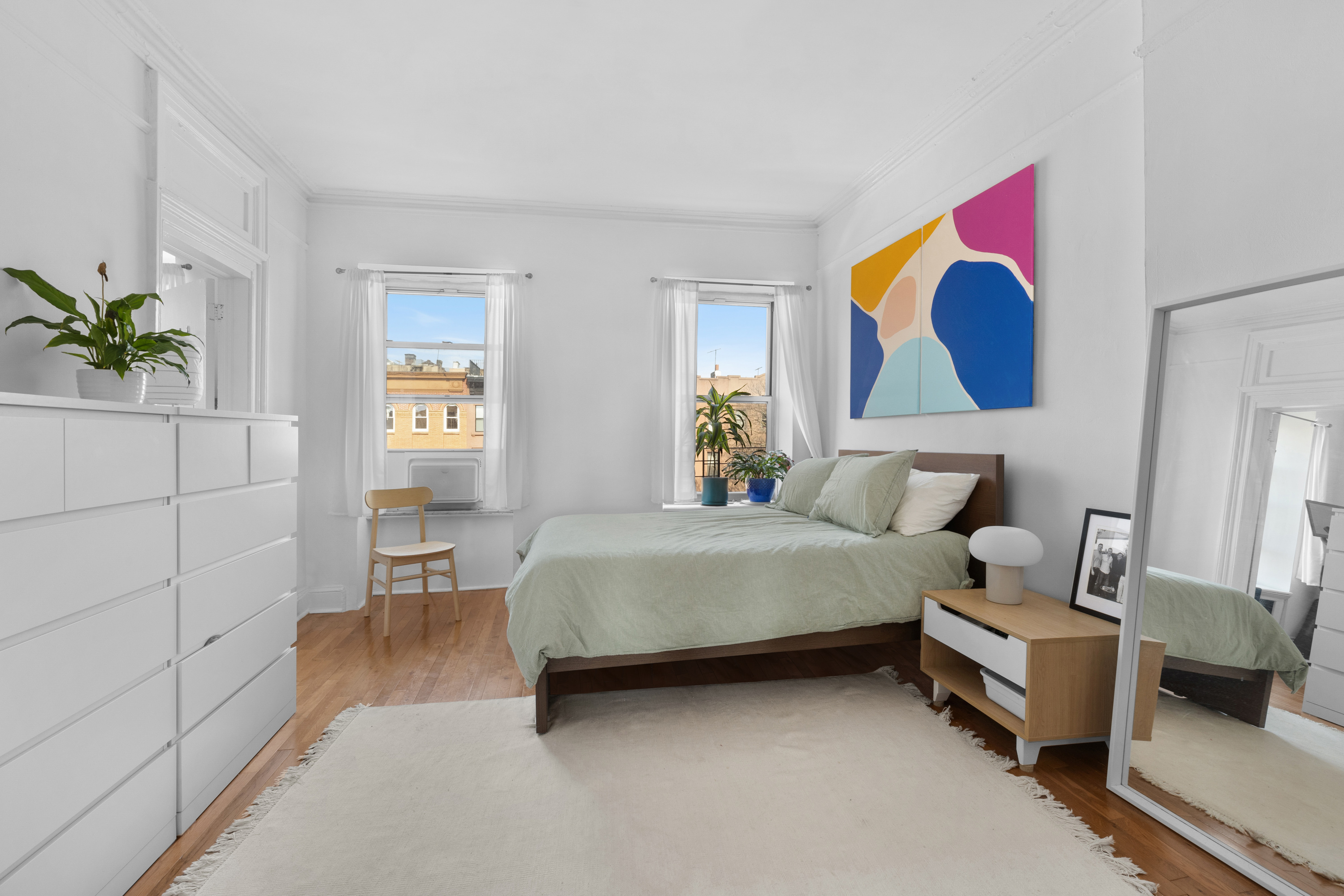 96 2nd Place Brooklyn, NY 11231 - Photo 11 of 14 a bedroom with a bed and a painting on the wall