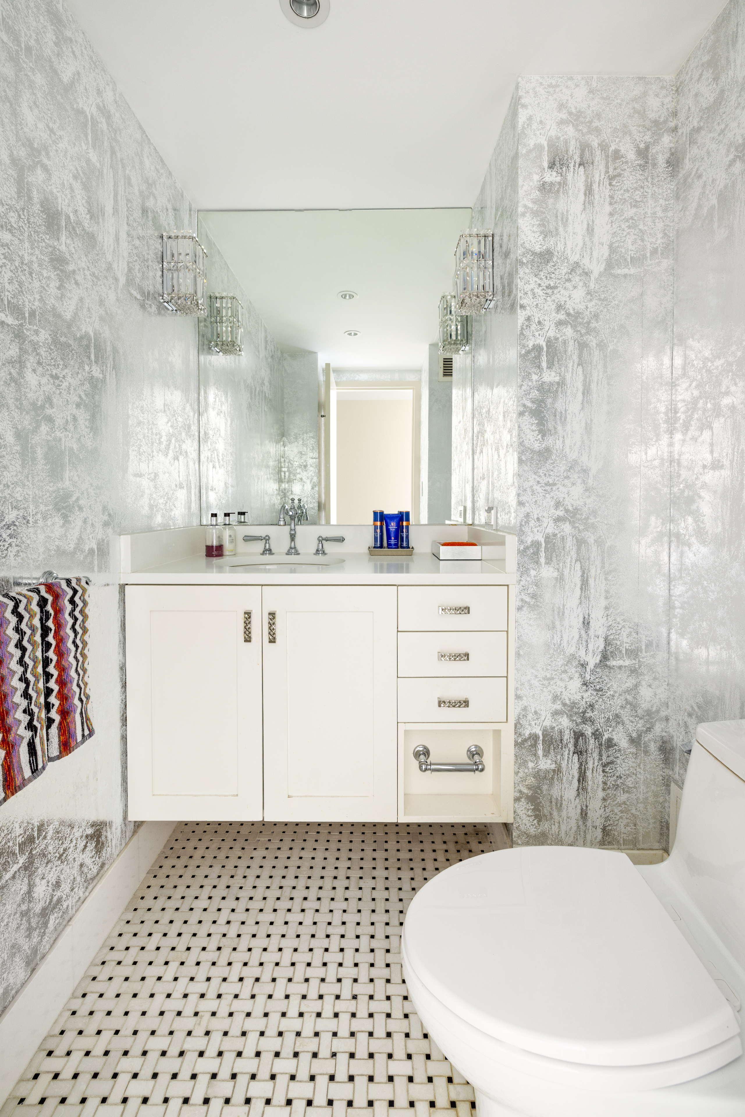 188 East 70th Street, Unit 22A Manhattan, NY 10021 - Photo 13 of 17 a bathroom with a sink a toilet and shower