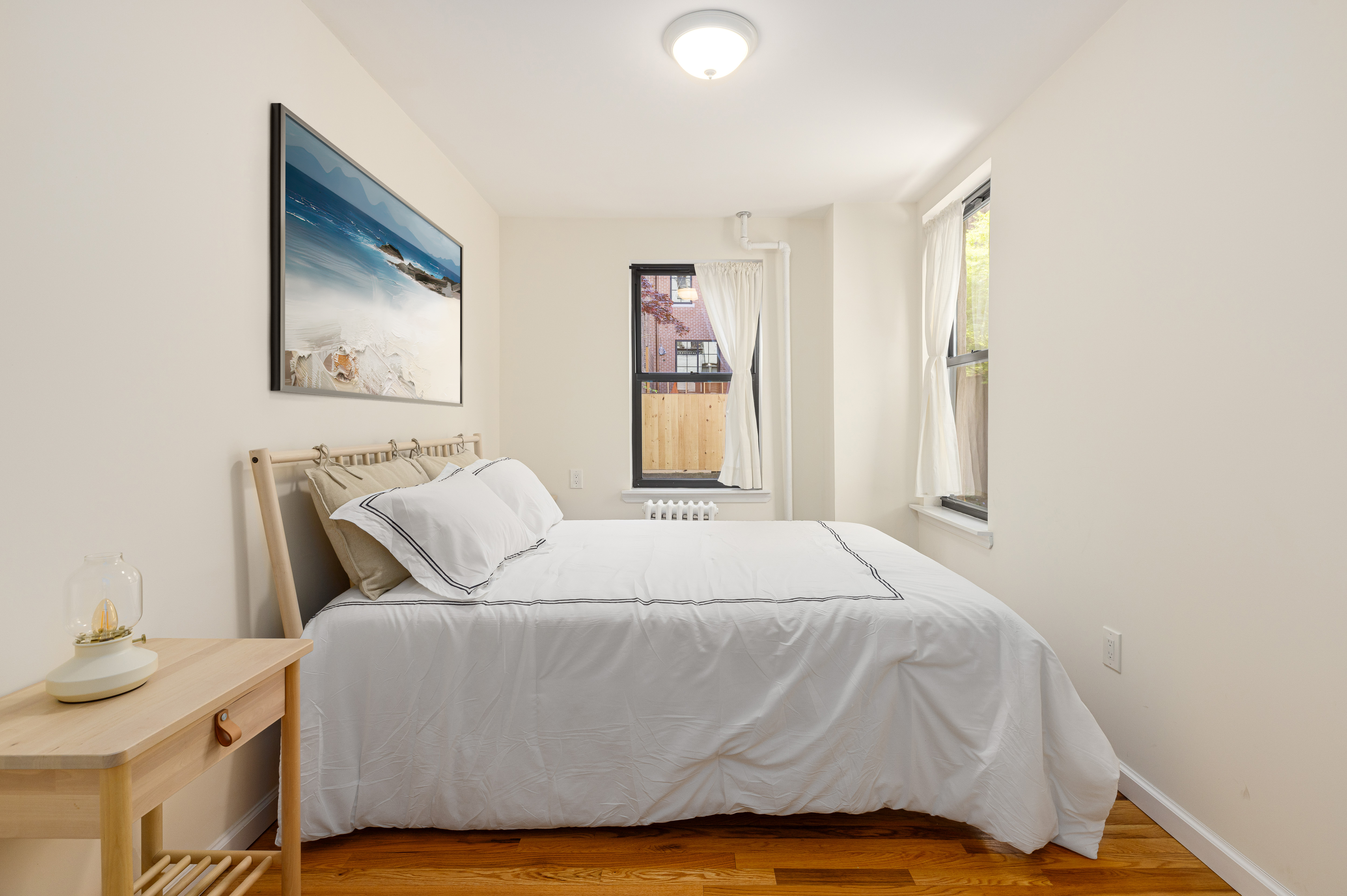 322 West 88th Street, Unit B Manhattan, NY 10024 - Photo 4 of 8 a bedroom with a bed and a window