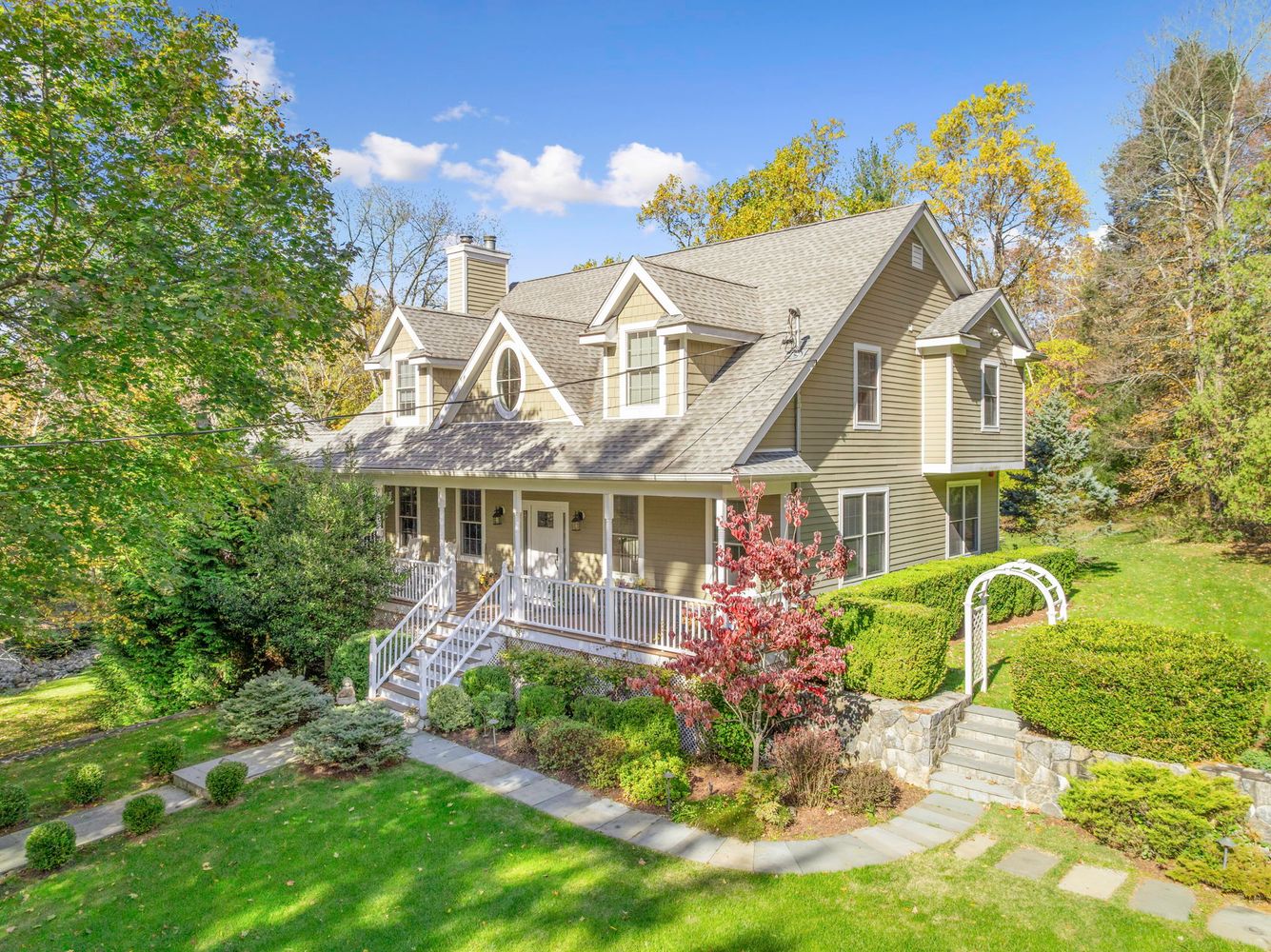 a front view of a house with garden