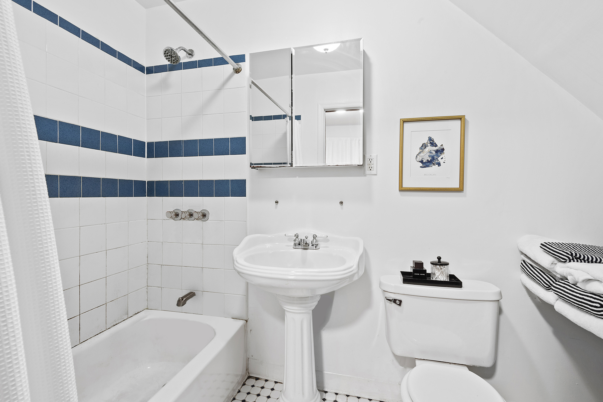 291 Sterling Place Brooklyn, NY 11238 - Photo 17 of 19 a bathroom with a sink toilet and shower