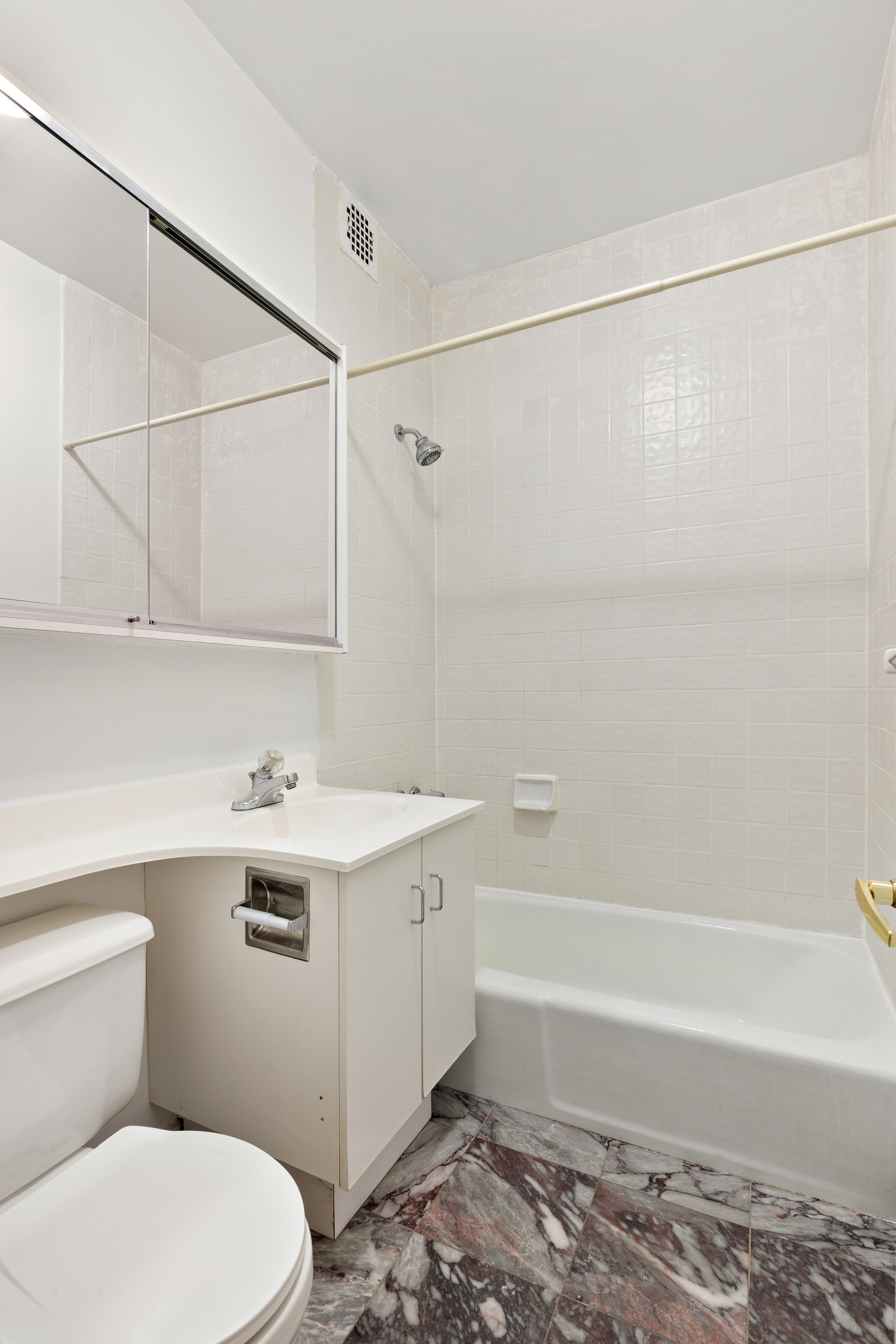 231 East 13th Street, Unit 6E Manhattan, NY 10003 - Photo 4 of 9 a bathroom with a sink a toilet and shower