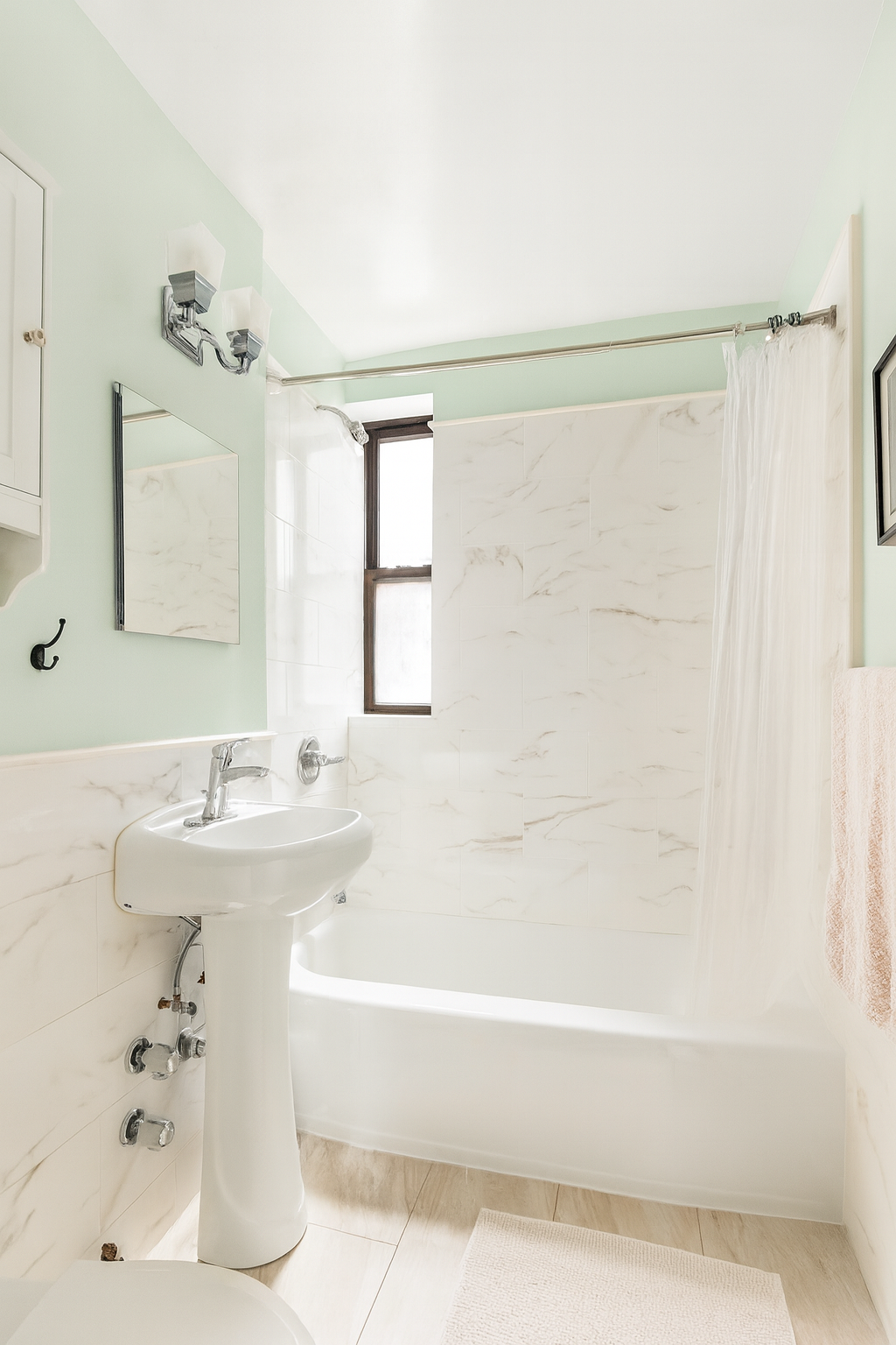 60 East 9th Street, Unit 512 Manhattan, NY 10003 - Photo 4 of 5 a bathroom with a bathtub and a sink