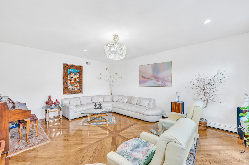 35 Poe Street Staten Island, NY 10307 - Photo 8 of 36 a living room with furniture and a chandelier