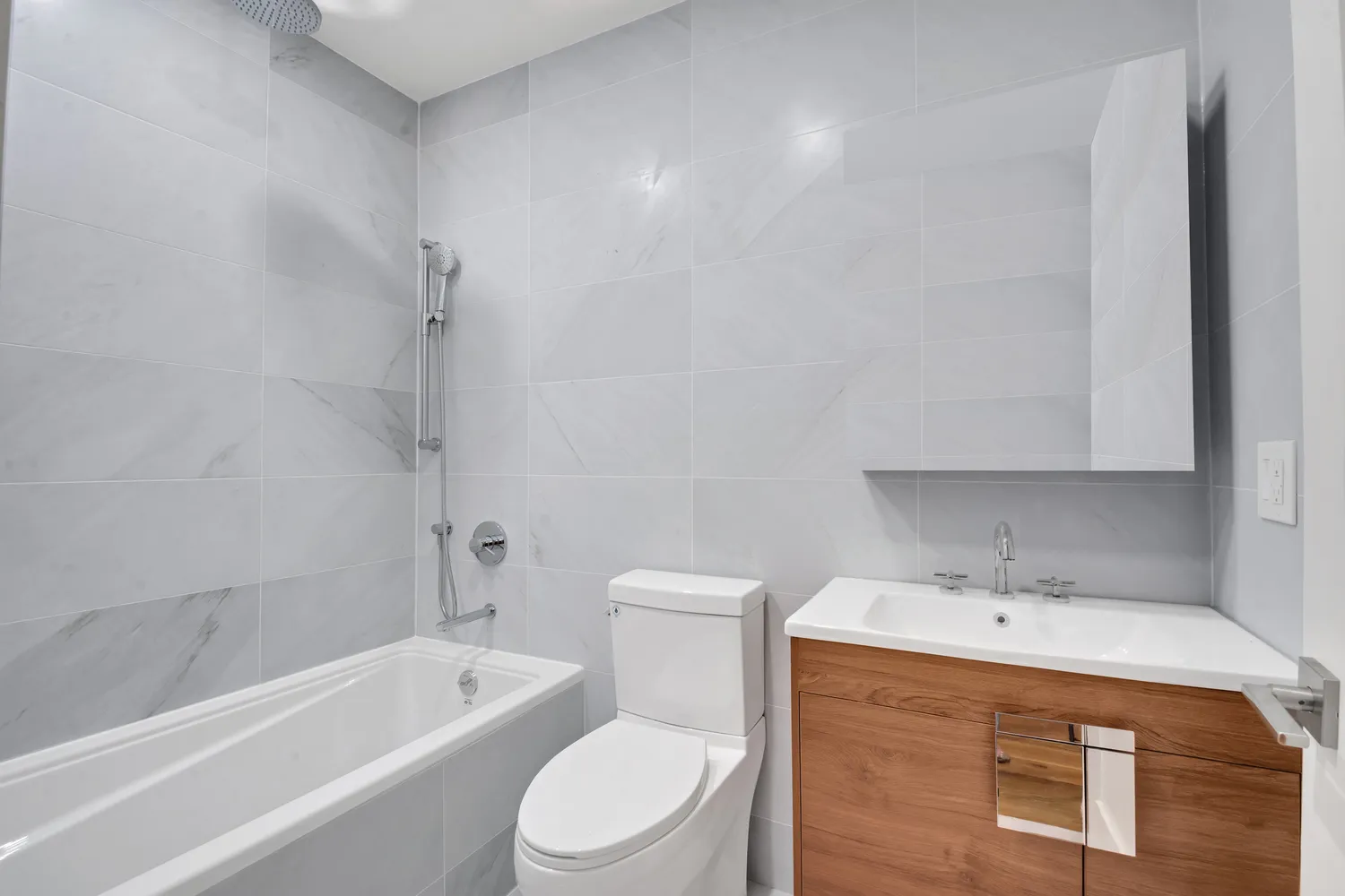 a bathroom with a sink a toilet and bathtub