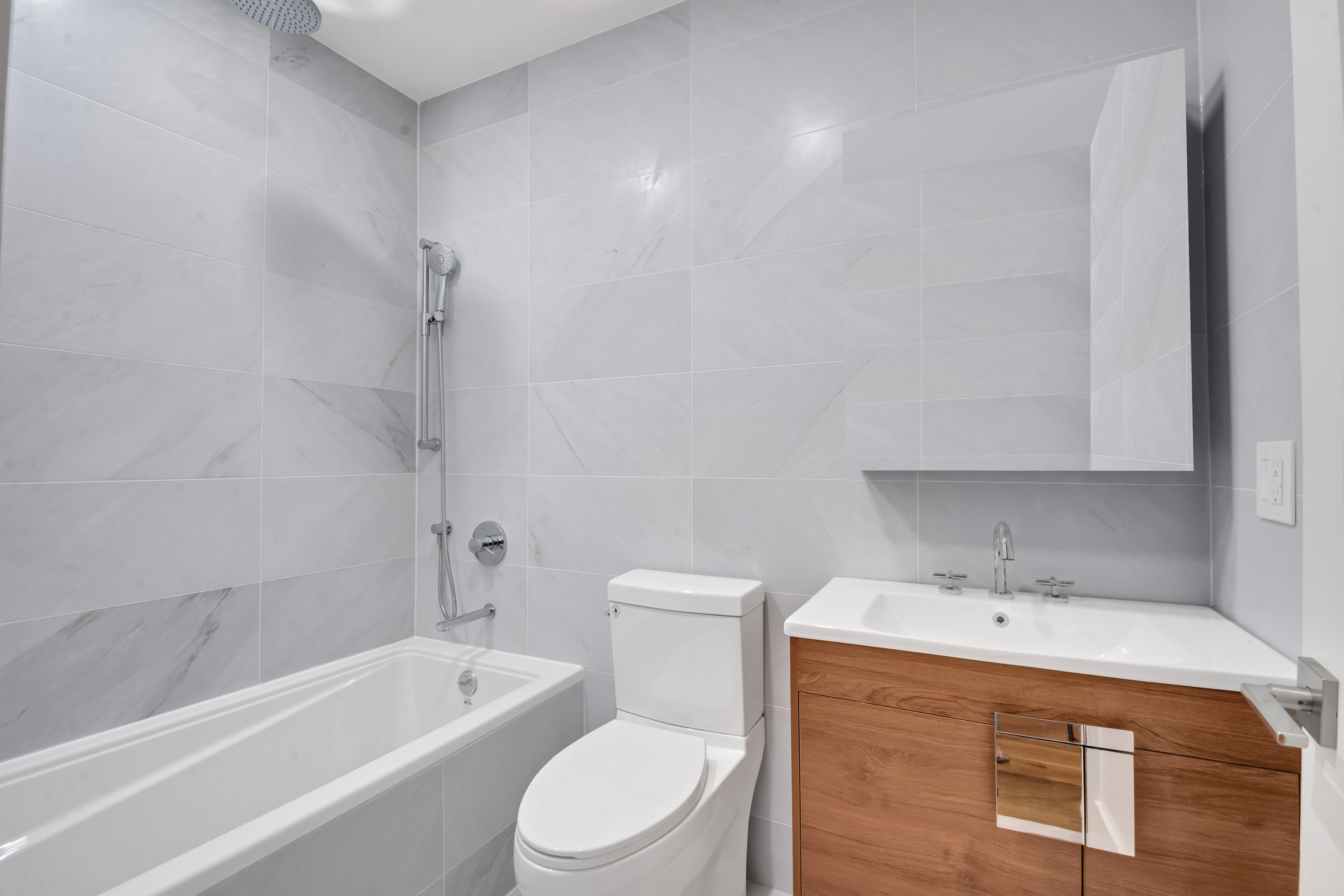 265 West 131st Street, Unit 2 Manhattan, NY 10027 - Photo 6 of 6 a bathroom with a sink a toilet and bathtub