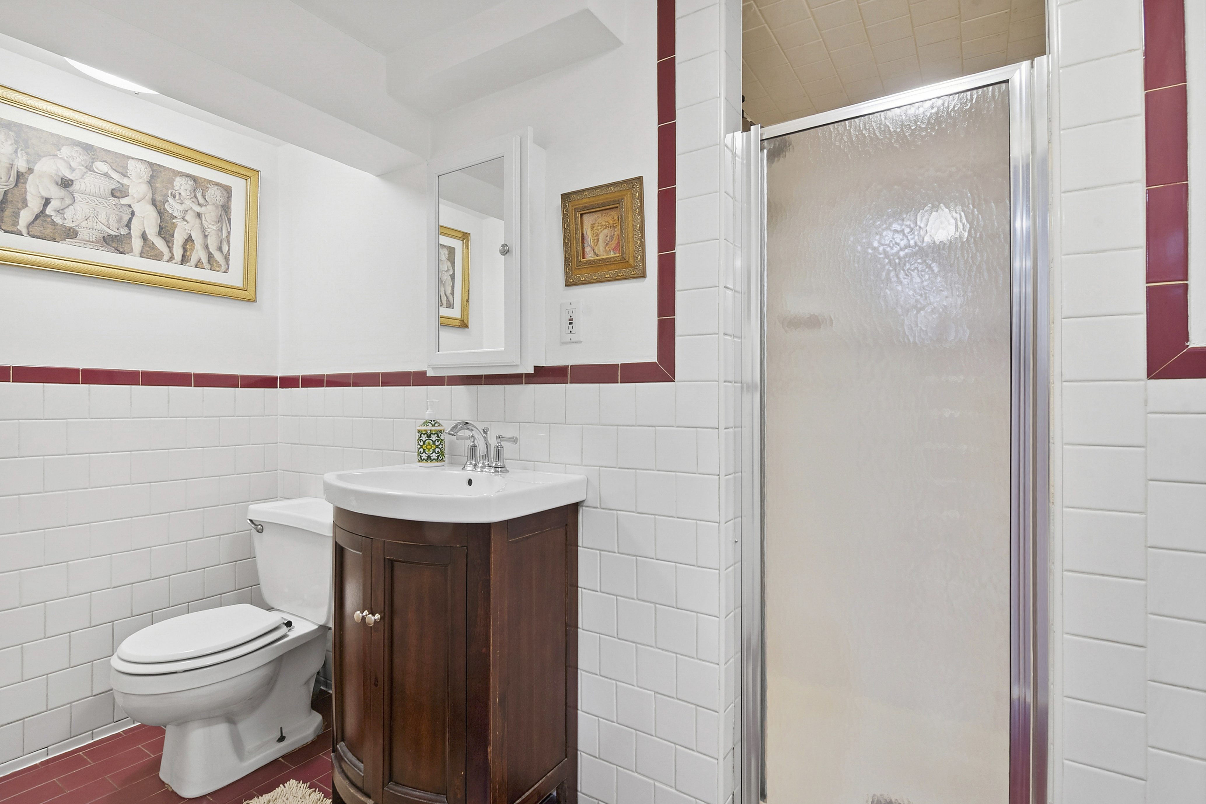 1384 East 29th Street Brooklyn, NY 11210 - Photo 14 of 21 a bathroom with a sink a toilet and shower