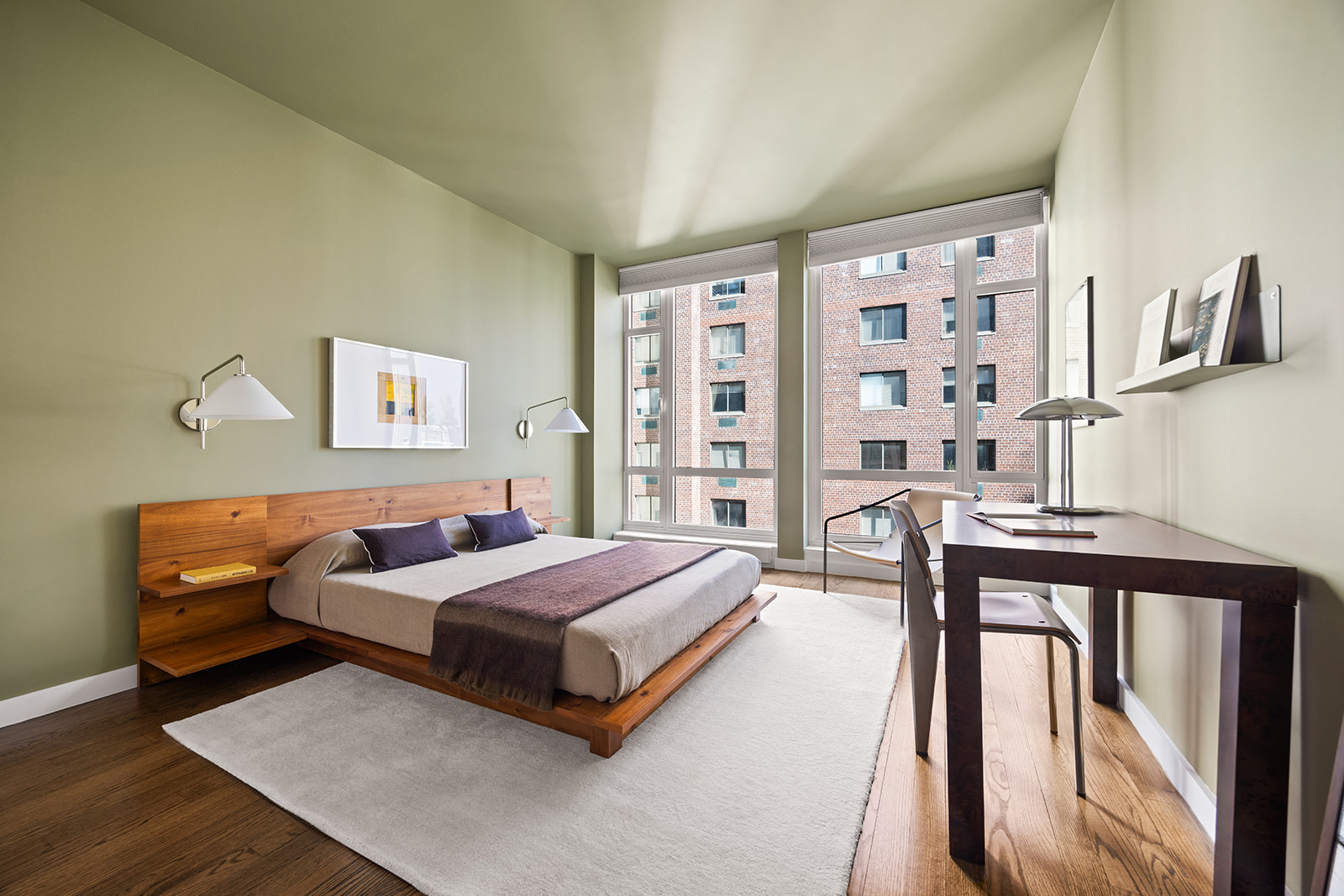 133 West 22nd Street, Unit 8G Manhattan, NY 10011 - Photo 7 of 16 a bedroom with a bed and a large window