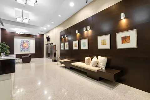 a view of a workspace with furniture and wooden floor