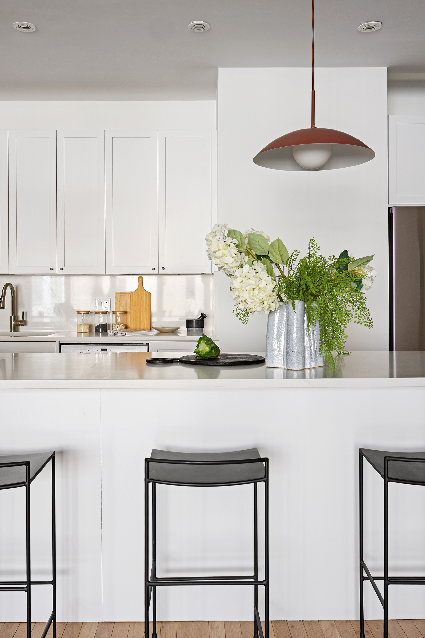 252 7th Avenue, Unit 9R Manhattan, NY 10001 - Photo 9 of 23 a kitchen with a sink a counter and a potted plant