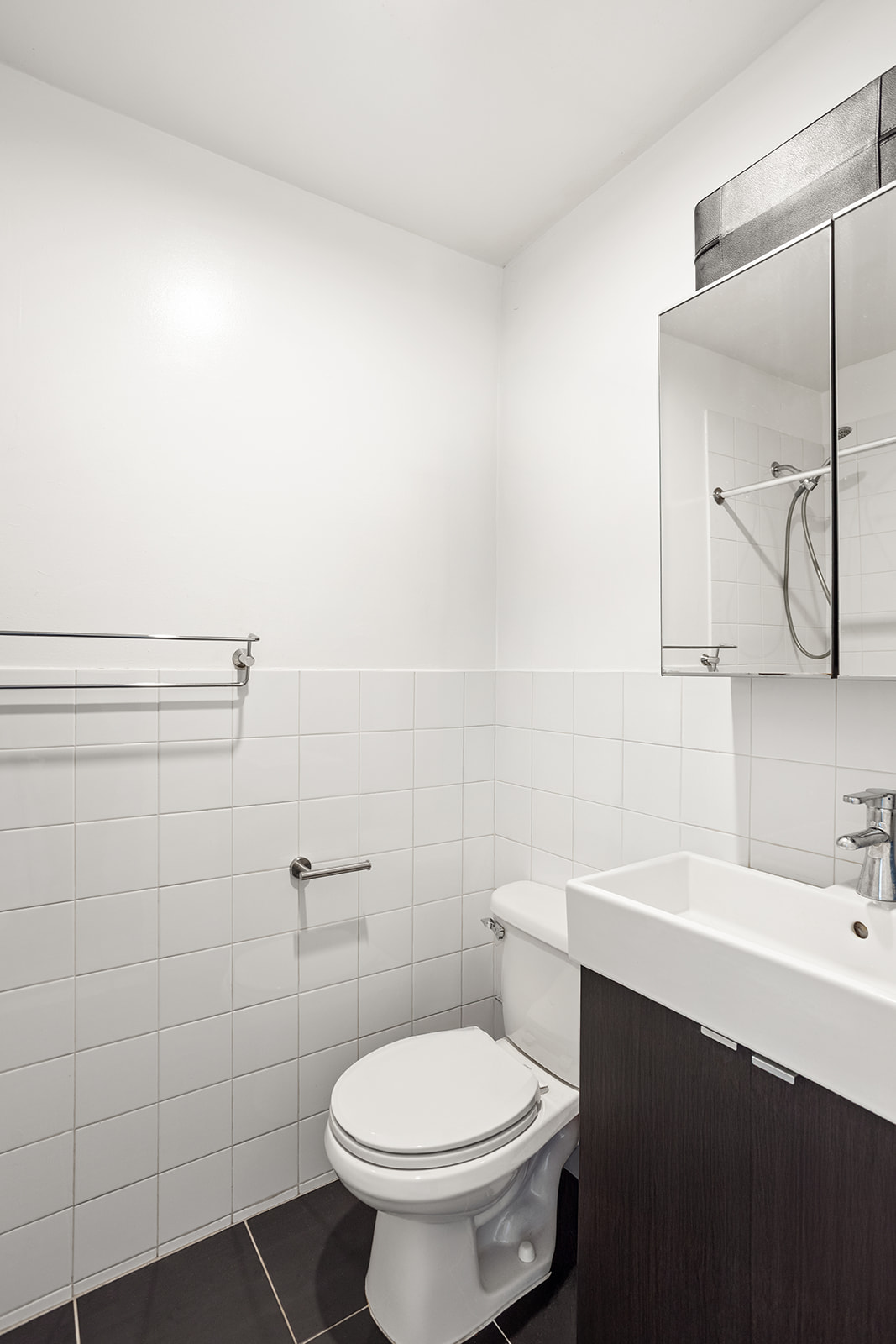 126 Sterling Place, Unit 2C Brooklyn, NY 11217 - Photo 7 of 8 a bathroom with a sink toilet and a mirror