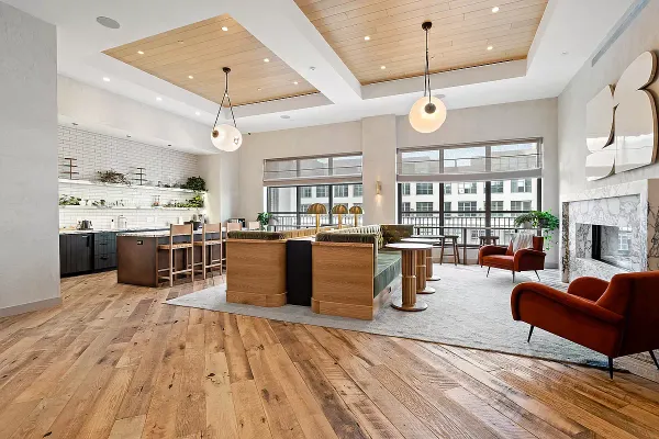 a large kitchen with stainless steel appliances lots of counter space and windows