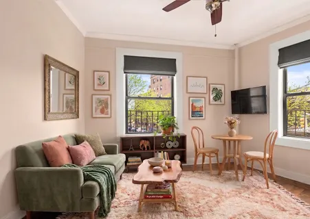 a living room with furniture and flat screen tv