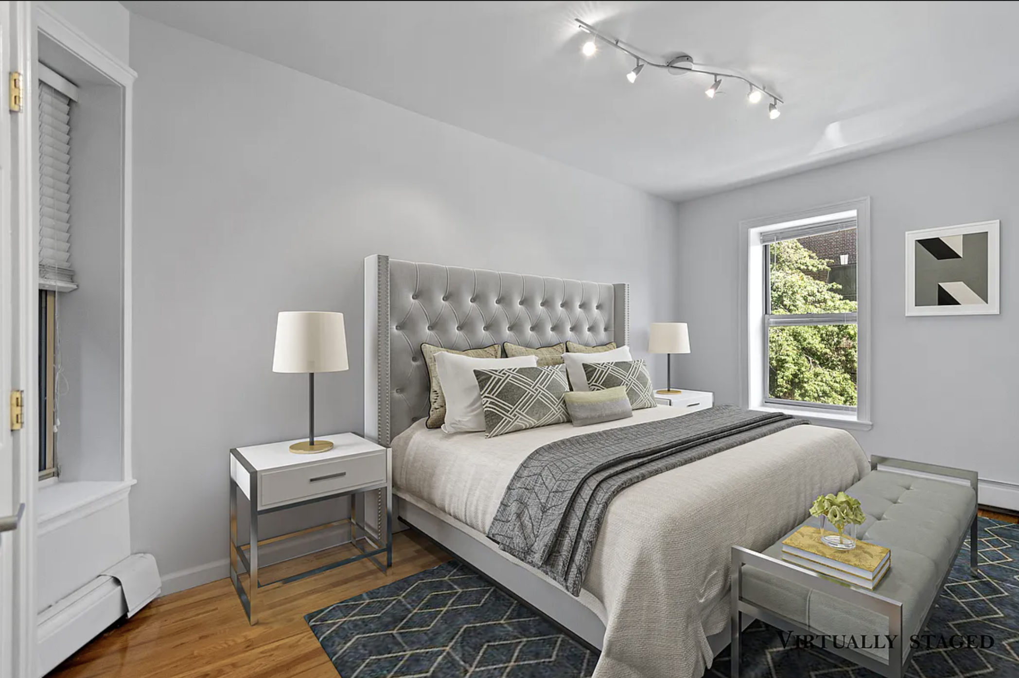 370 Convent Avenue, Unit 3B Manhattan, NY 10031 - Photo 5 of 12 a bedroom with a bed and a lamp